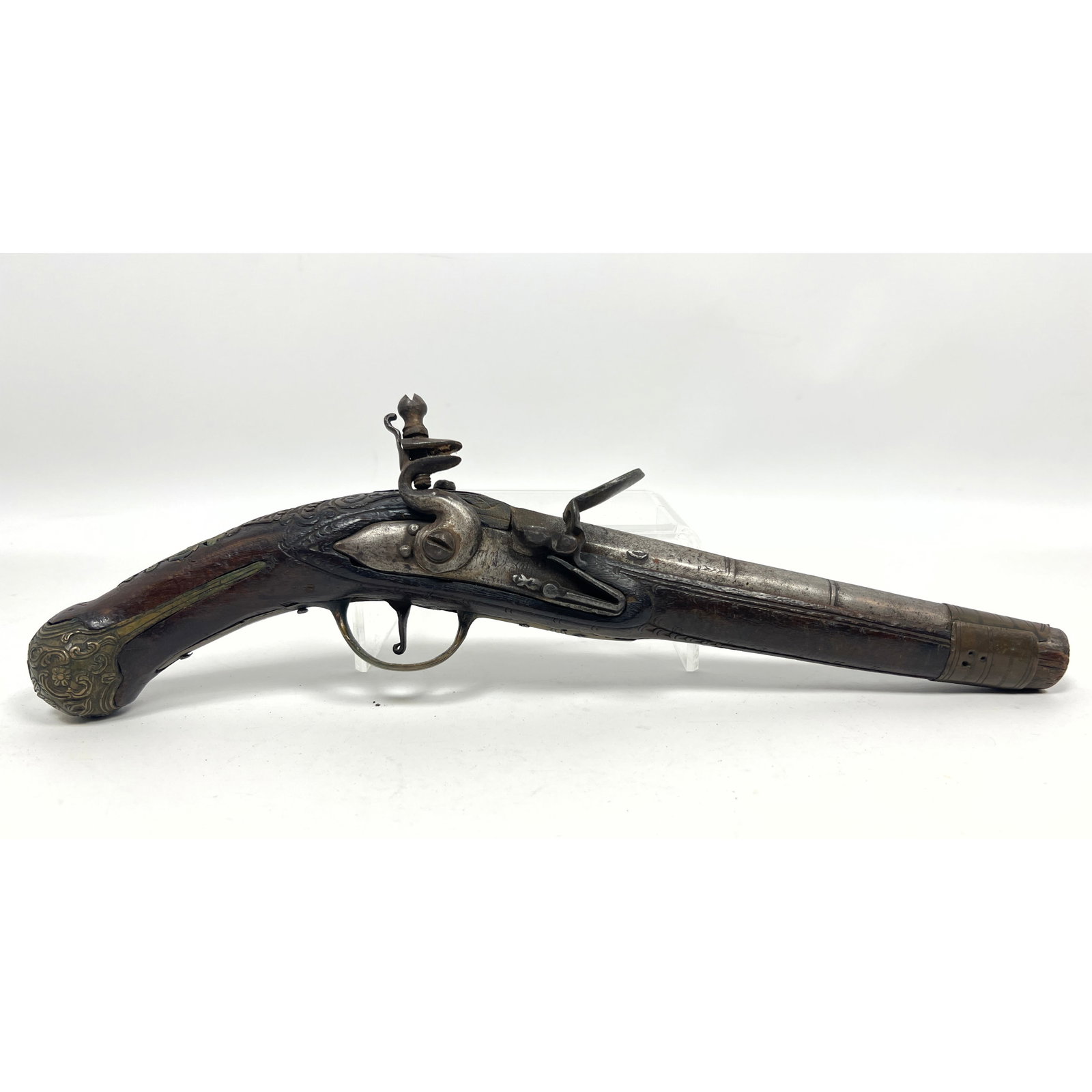 Large-bore antique flintlock muzzleloading holster pistol featuring a tapered iron barrel and a heav (1 of 13)