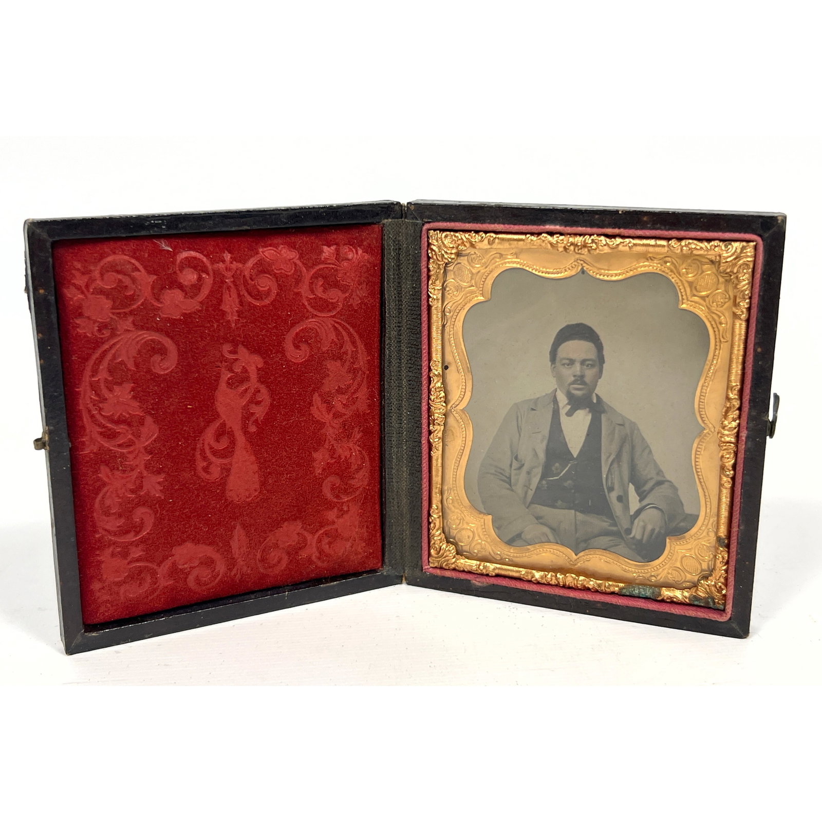 Sixth-plate tintype features a formal studio portrait of a Black man, depicted from the waist up and (1 of 9)