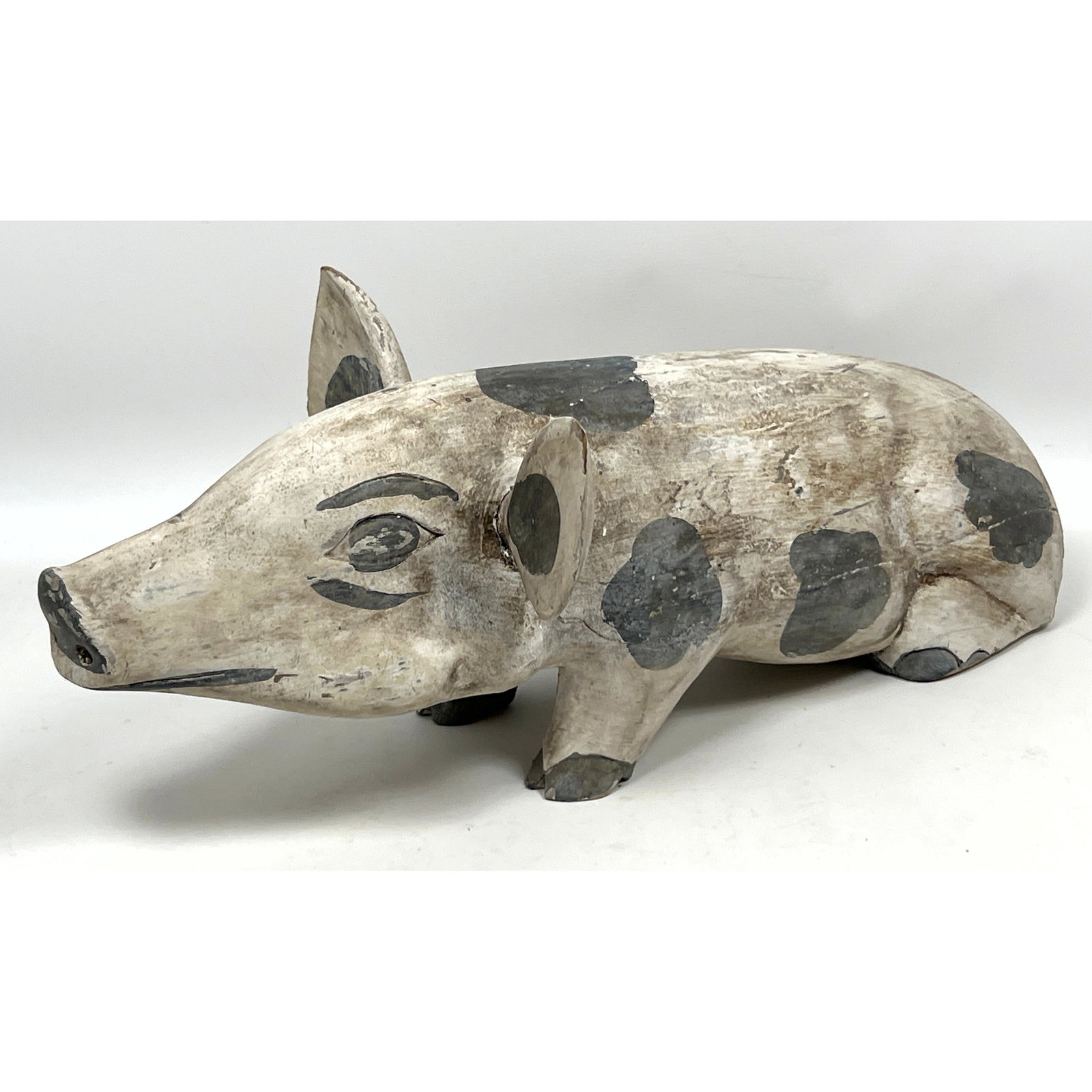 Hand-carved wooden figurine of a standing pig, executed in a primitive folk art style. (1 of 11)