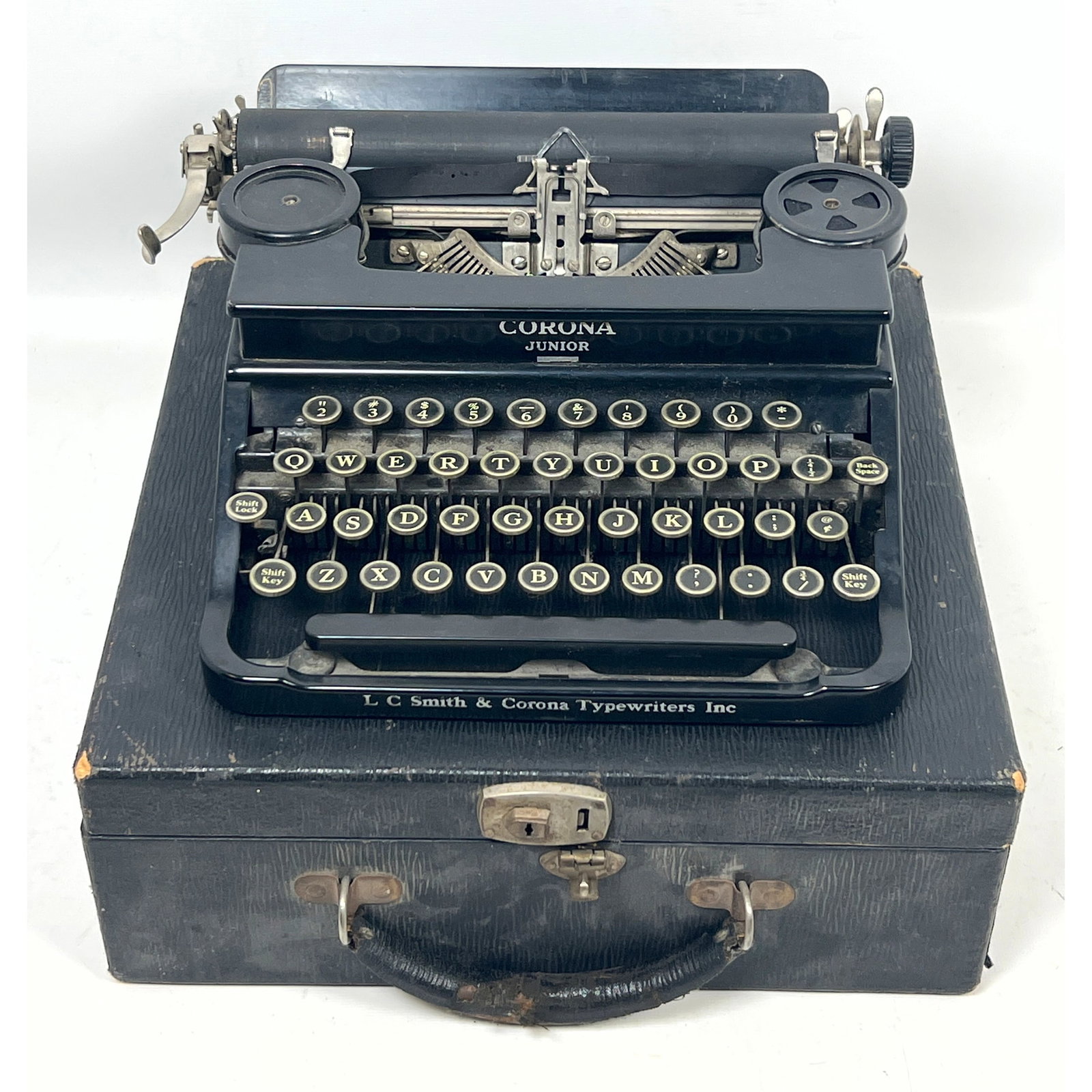 Corona Junior portable type writer. 1930s: Corona Junior portable type writer. 1930s Dimensions: Height: 5 inches, Width: 13.25 inches, Depth: 13.5 inches. ---