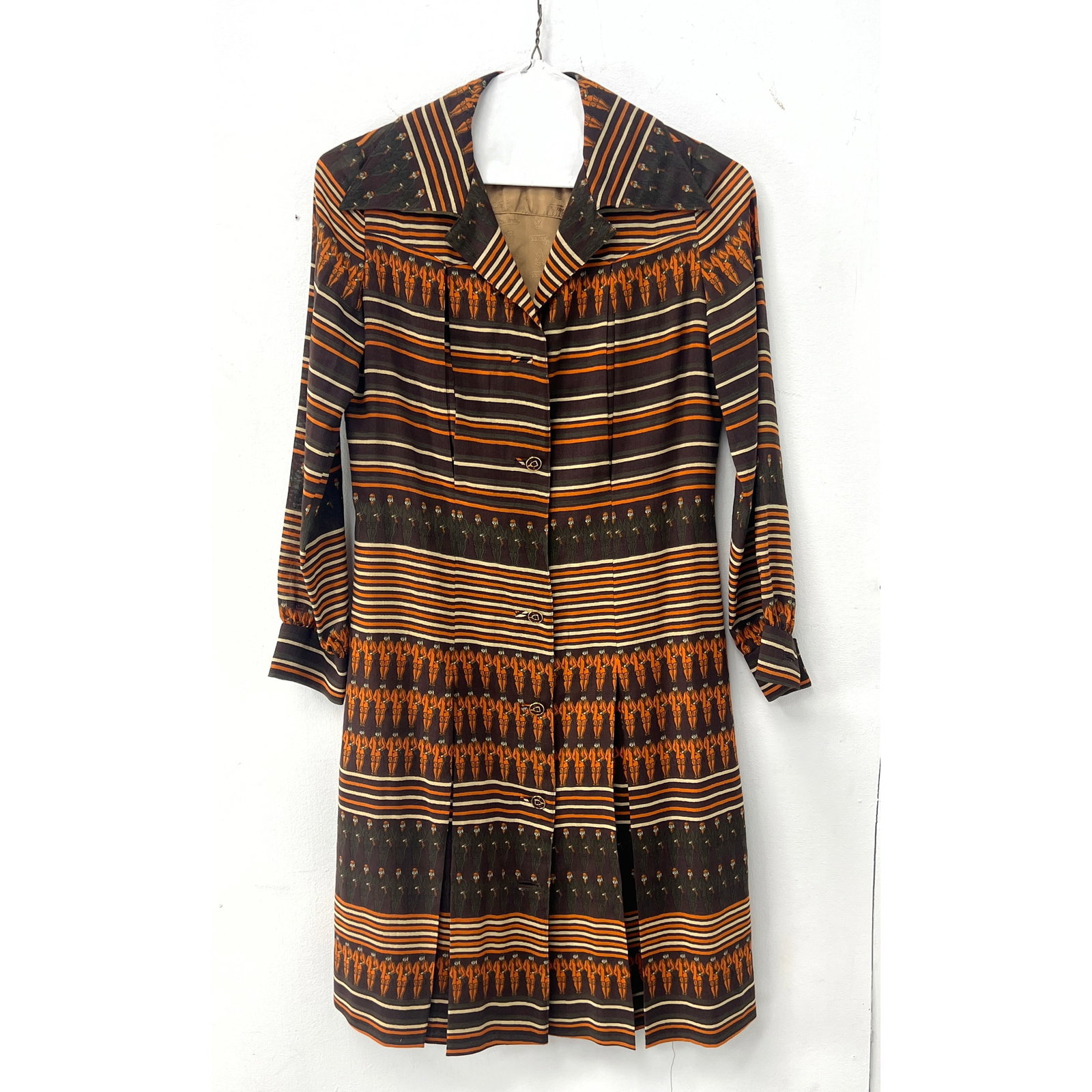 Vintage long-sleeved button-front coat-dress. authentic Gucci piece from the 1970s: Vintage long-sleeved button-front coat-dress. authentic Gucci piece from the 1970s Dimensions: Height: 41 inches, Width: 17 inches. --- US Packing and Shipping charge: In house shipping available.