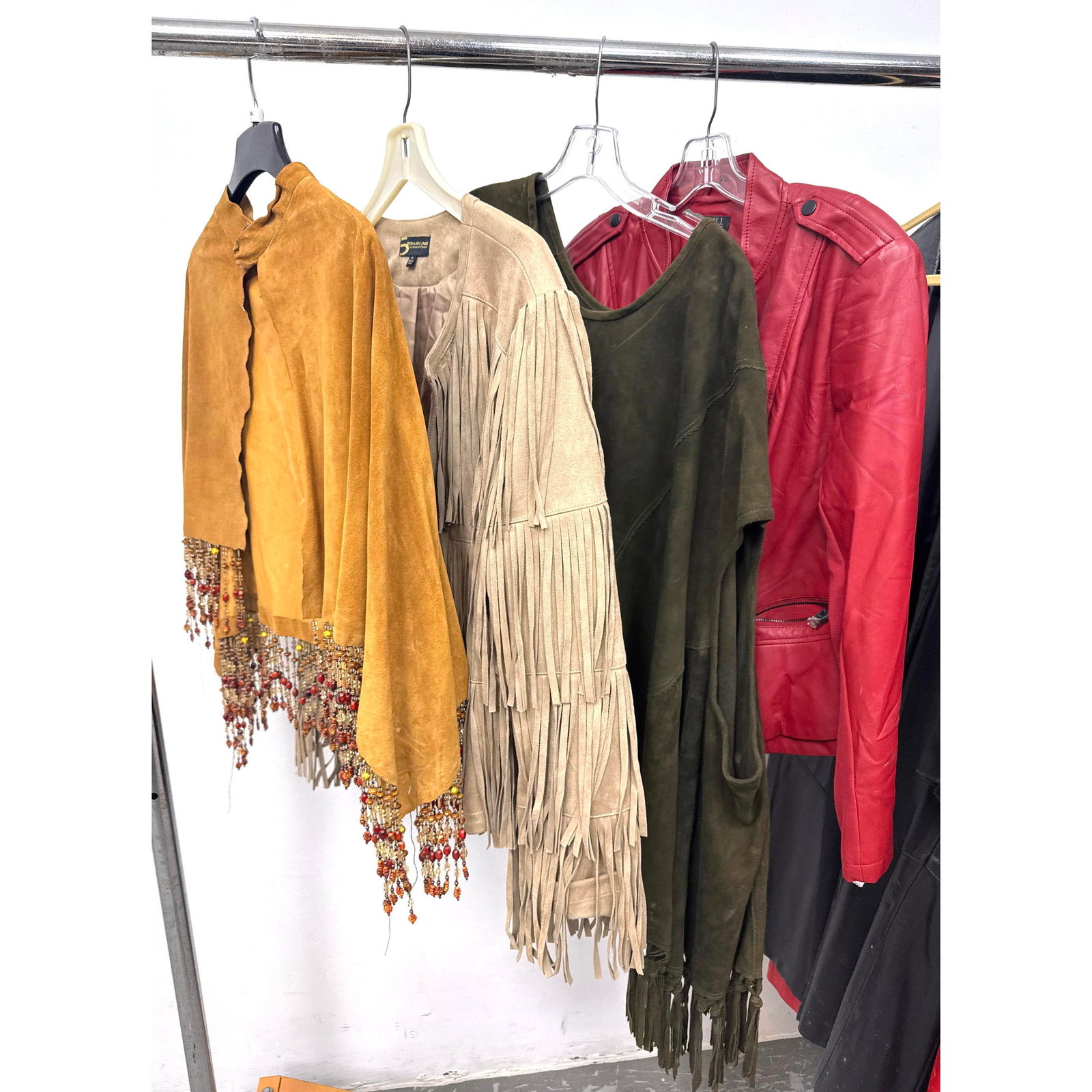 4pcs Vintage Leather and Suede Coats. Mustard-toned suede open-front capelet featuring a mock neck c: 4pcs Vintage Leather and Suede Coats. Mustard-toned suede open-front capelet featuring a mock neck collar and a decorative oval metal brooch with tiered bead tassels pinned to the front. Jacket from t