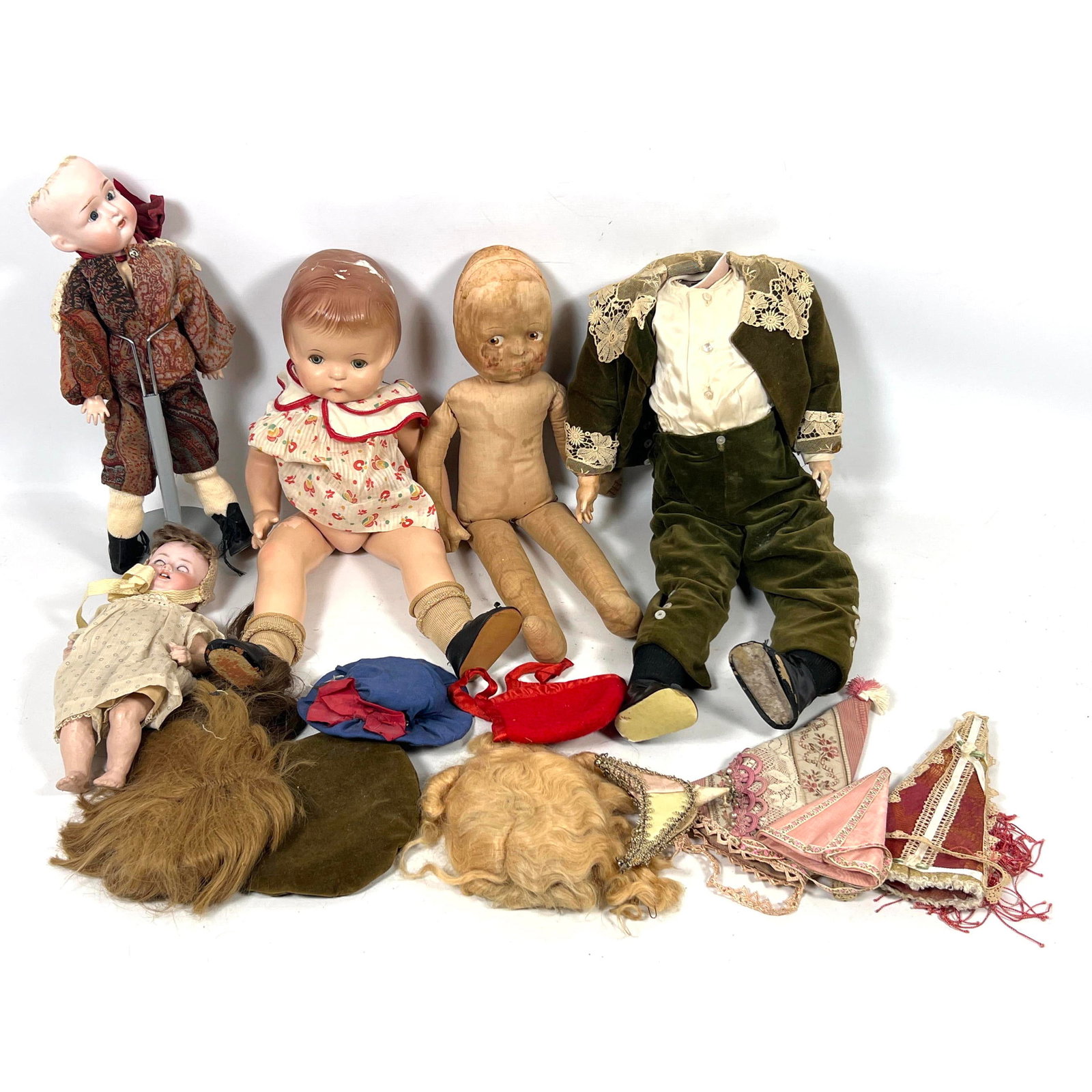 Assortment of dolls and accessories from the early to mid-20th century. A primary item is a composit (1 of 15)