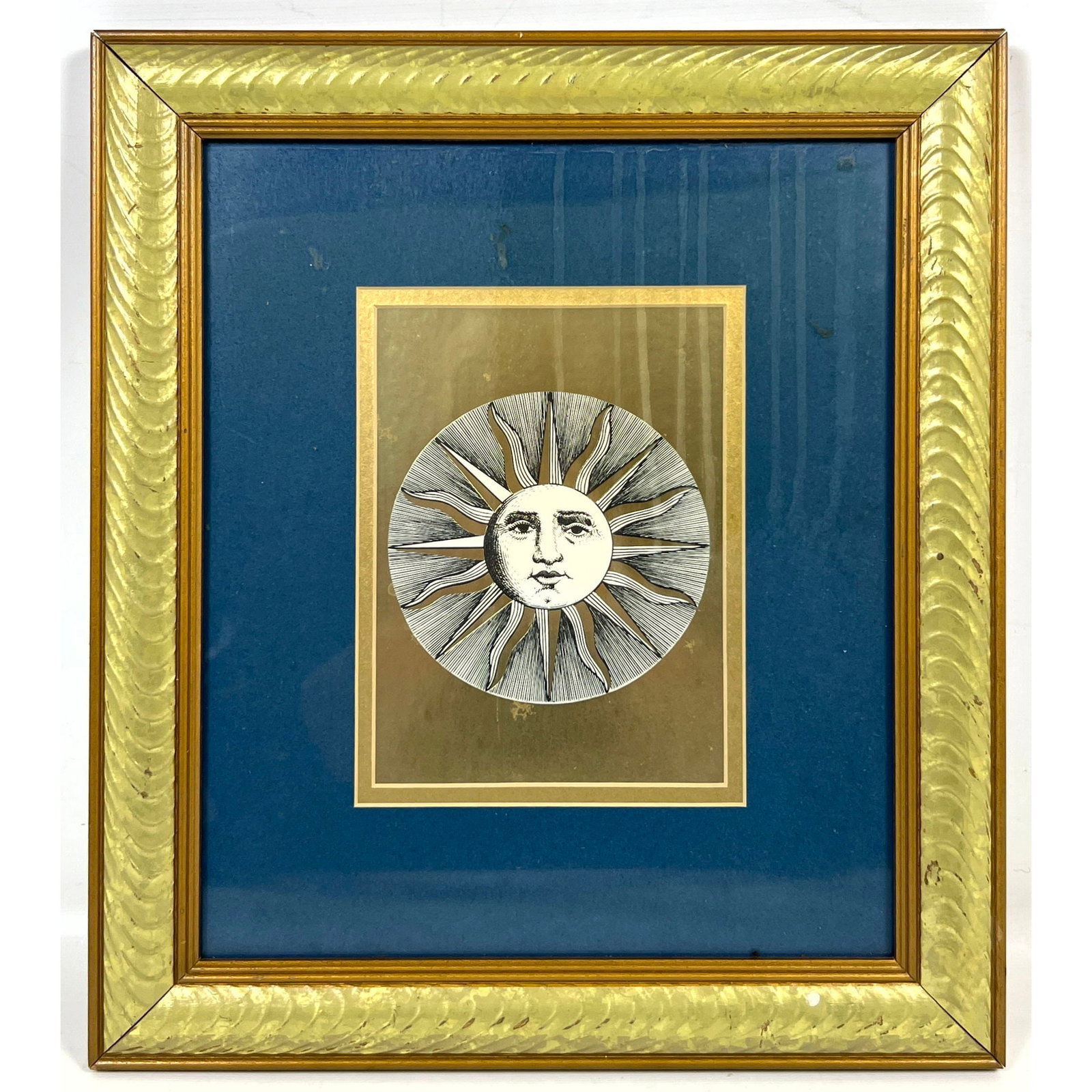 Framed Piero Fornasetti style Soli Sun print on metallic gold field with deep blue mat and gold tone: Framed Piero Fornasetti style Soli Sun print on metallic gold field with deep blue mat and gold toned frame Dimensions: Frame Height: 14.5 inches, Frame Width: 12.5 inches. - Image Size: Image Height: