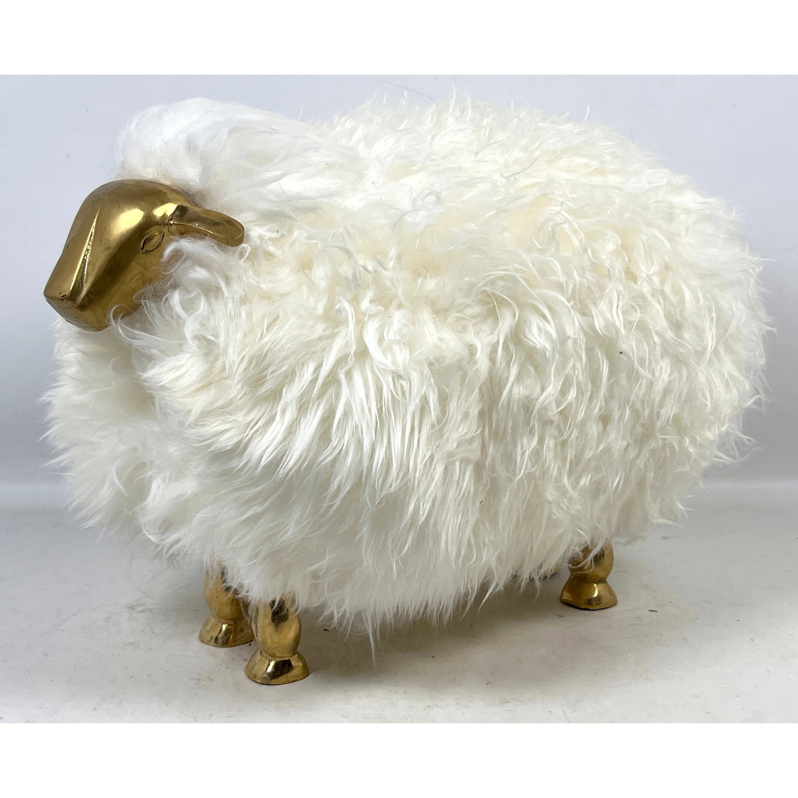 Small sheep sculpture in the style of Francois-Xavier Lalanne. Brass legs and face, genuine sheep sk: Small sheep sculpture in the style of Francois-Xavier Lalanne. Brass legs and face, genuine sheep skin fur. Dimensions: Height: 14 inches, Width: 12 inches, Depth: 22 inches. --- US Packing and Shippi