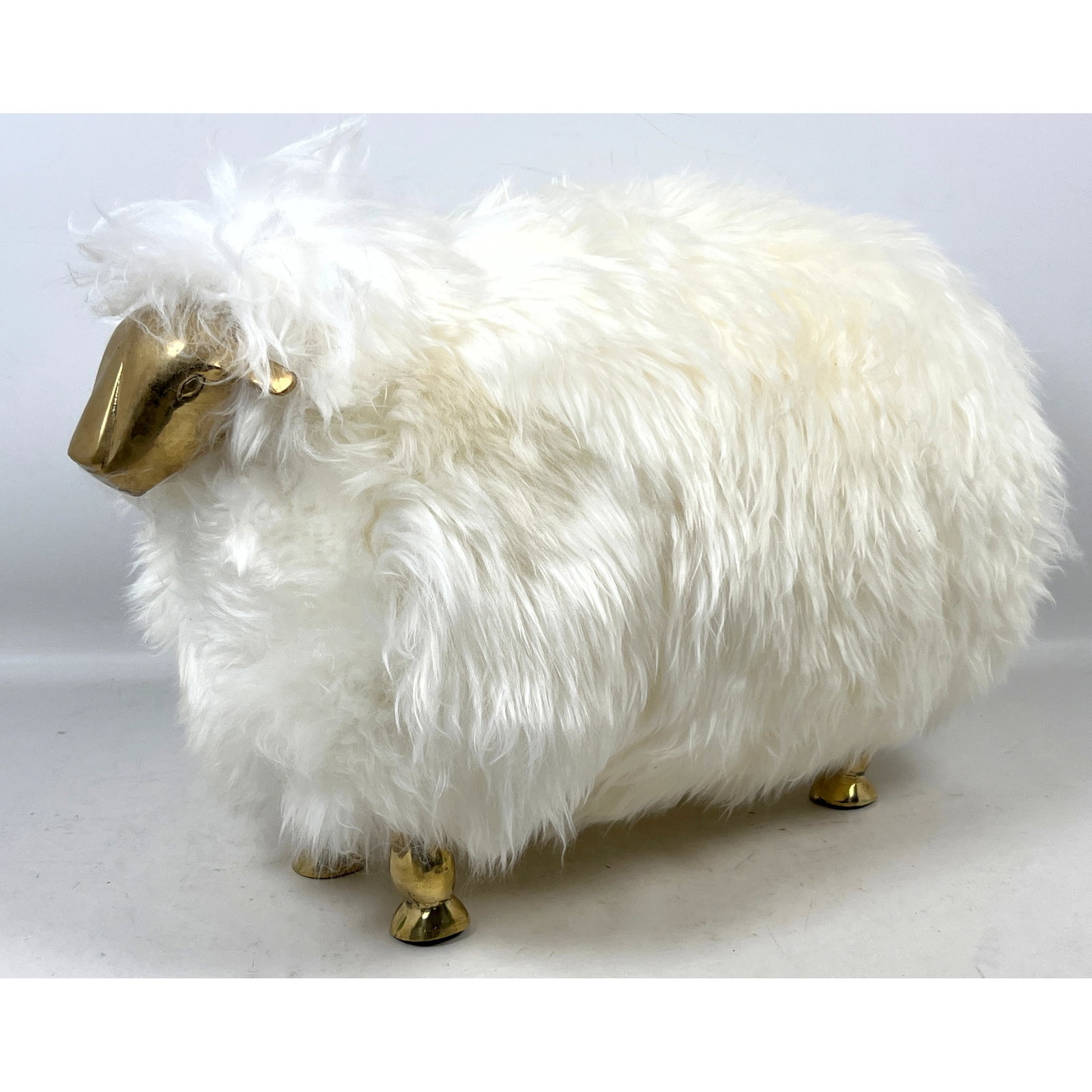 Small sheep sculpture in the style of Francois-Xavier Lalanne. Brass legs and face, genuine sheep sk: Small sheep sculpture in the style of Francois-Xavier Lalanne. Brass legs and face, genuine sheep skin fur. Dimensions: Height: 15 inches, Width: 12 inches, Depth: 25 inches. --- US Packing and Shippi