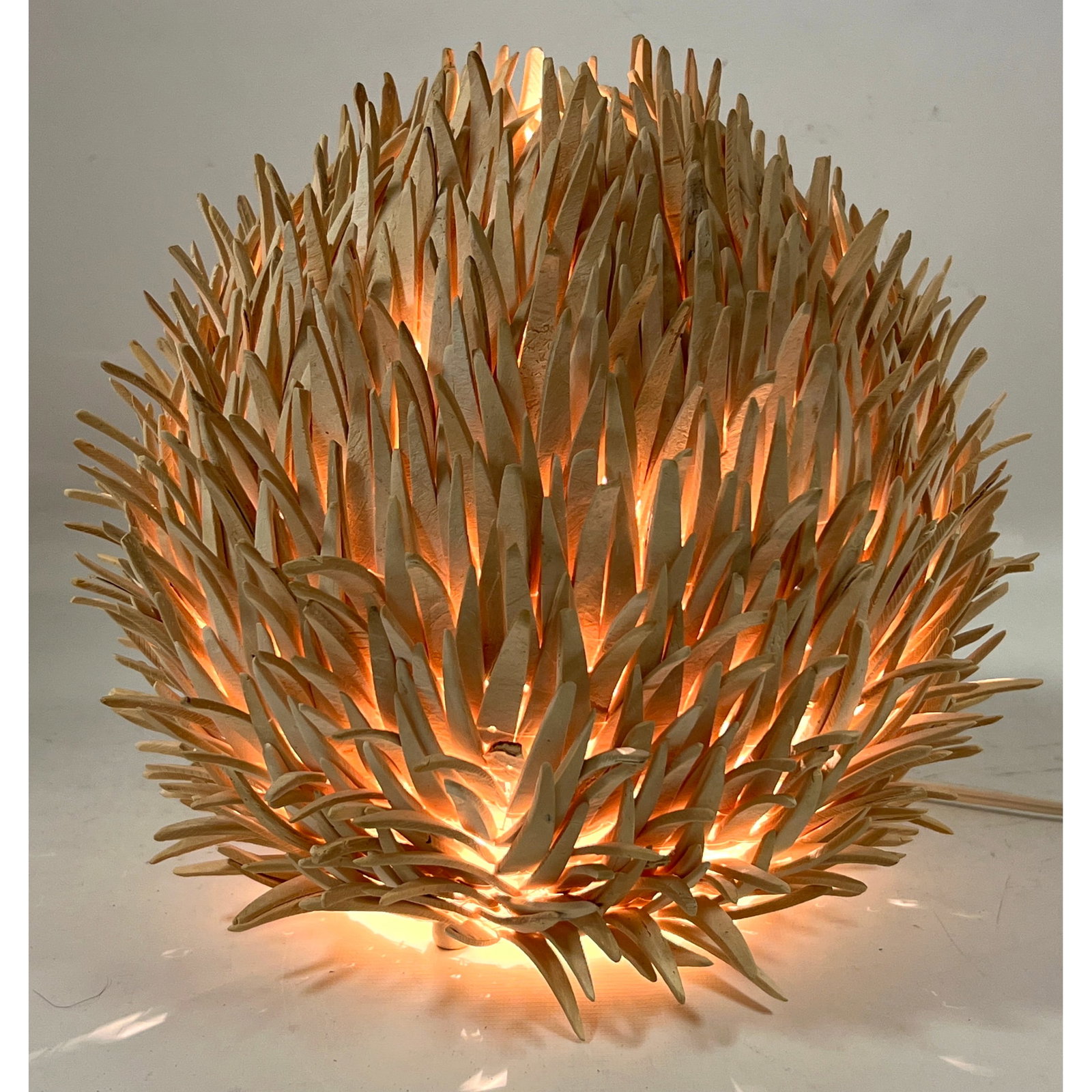 Danish Sea Urchin Table Lamp. Hundreds of bleached coconut wood spines on metal frame.: Danish Sea Urchin Table Lamp. Hundreds of bleached coconut wood spines on metal frame. Dimensions: Height: 12 inches, Width: 12 inches, Depth: 12 inches. --- US Packing and Shipping charge: In house s