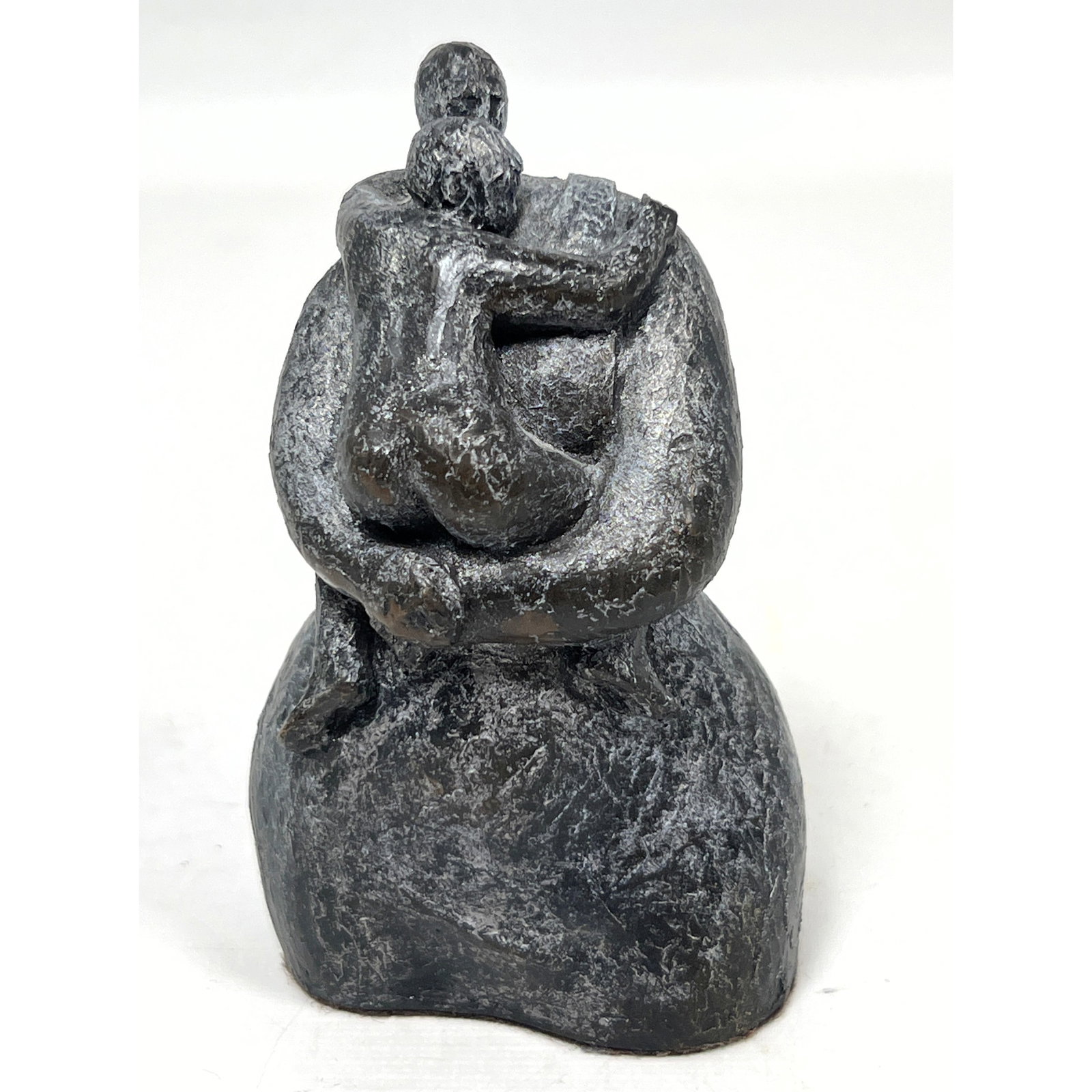 Bronze Lucille Challenger Modernist Figurative Sculpture depicting two figures in embrace numbered 4: Bronze Lucille Challenger Modernist Figurative Sculpture depicting two figures in embrace numbered 46/150 signed by the artist Dimensions: Height: 4.5 inches, Width: 2.5 inches, Depth: 2 inches. --- U