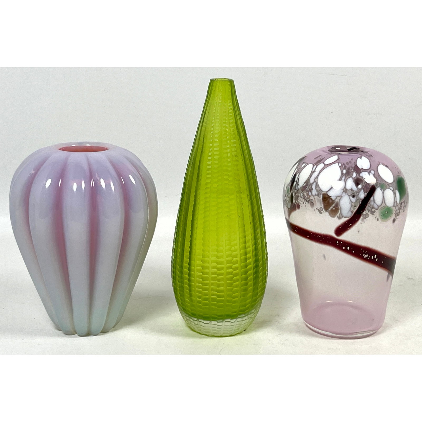 3pc lot of Art Glass. One signed Bo 88, one green faceted Murano style, one ribbed opalescent Murano: 3pc lot of Art Glass. One signed Bo 88, one green faceted Murano style, one ribbed opalescent Murano cased glass. Dimensions: Height: 8.5 inches, Width: 3 inches, Depth: 3 inches. --- US Packing and S