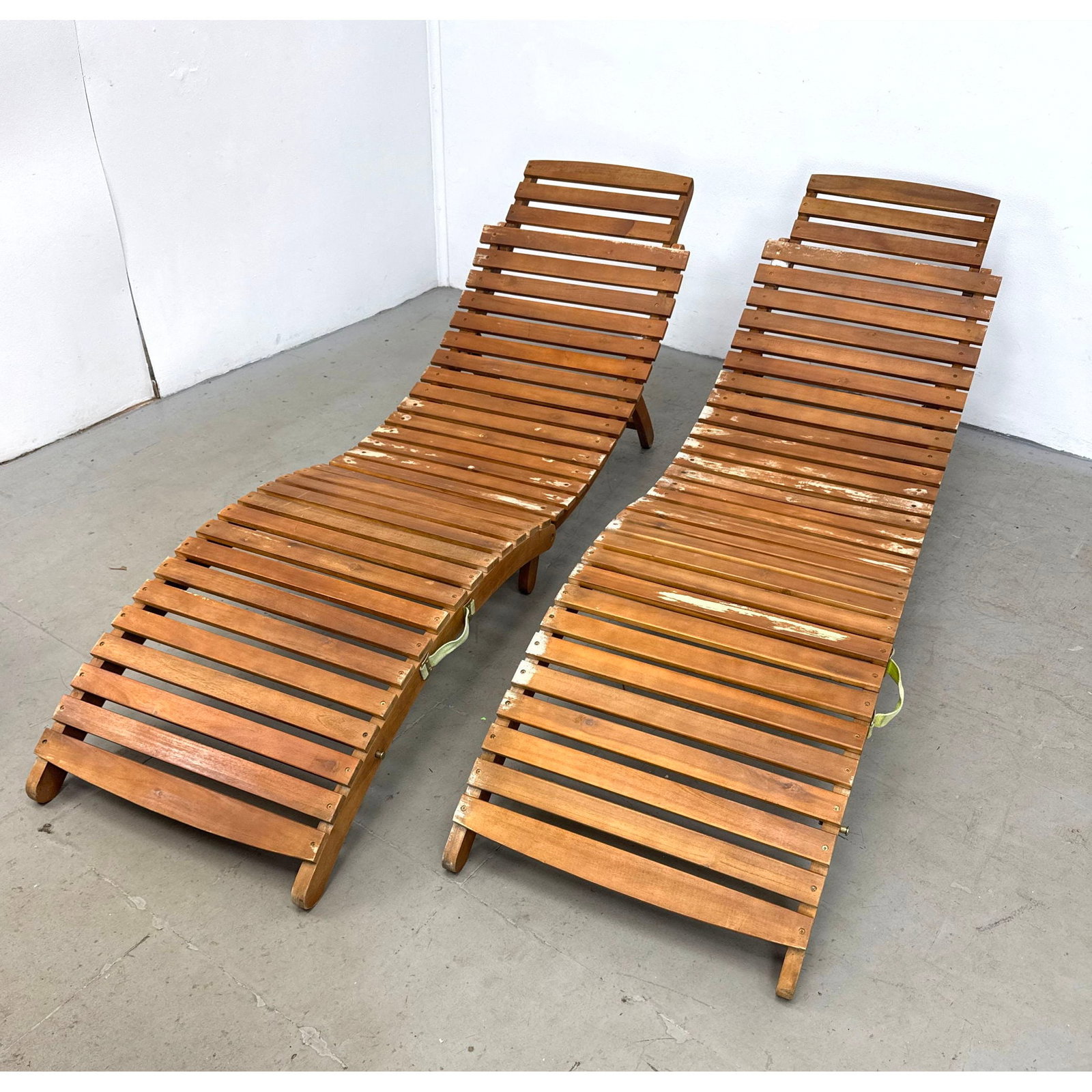 Pair of Safavieh wooden slat folding chaise lounge chairs with ergonomic curved profile and integrat (1 of 16)