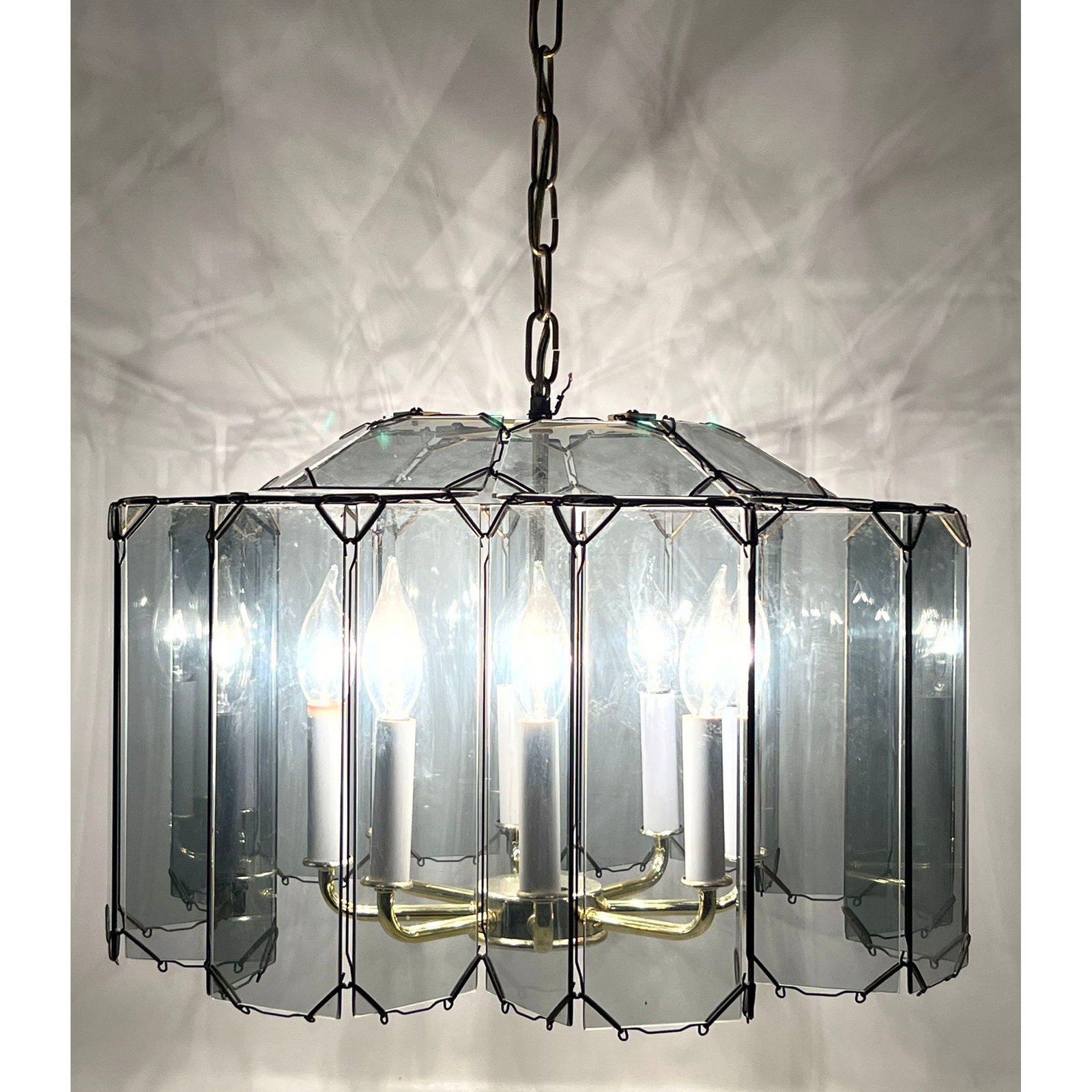 Mid Century Modern 6 light smoked beveled glass faceted starburst chandelier with brass framework: Mid Century Modern 6 light smoked beveled glass faceted starburst chandelier with brass framework Dimensions: Height: 12 inches, Width: 20 inches, Depth: 20 inches. ---