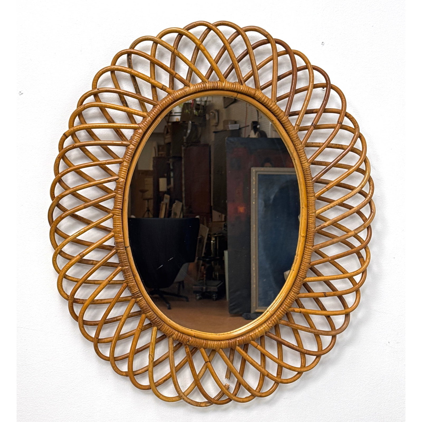 Italian Style Rattan and Cane Oval Wall Mirror in the style of Franco Albini.: Italian Style Rattan and Cane Oval Wall Mirror in the style of Franco Albini. Dimensions: Height: 31 inches, Width: 24 inches, Depth: 2 inches. ---
