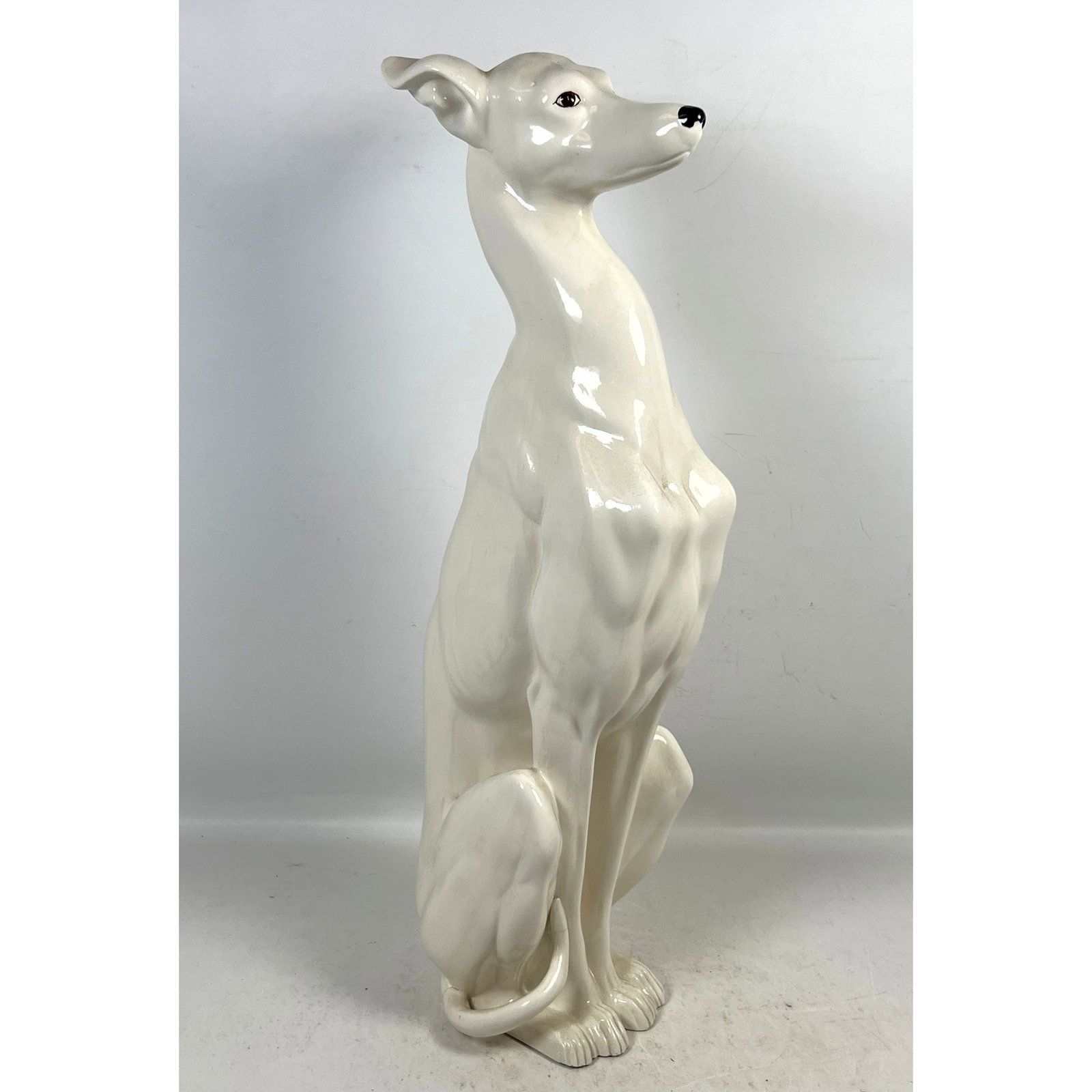 Large Seated Greyhound Ceramic Figurine. High Gloss White Glaze. Hand signed Maria Ortiz on bottom.: Large Seated Greyhound Ceramic Figurine. High Gloss White Glaze. Hand signed Maria Ortiz on bottom. Dimensions: Height: 29 inches, Width: 7.25 inches, Depth: 9 inches. --- US Packing and Shipping char