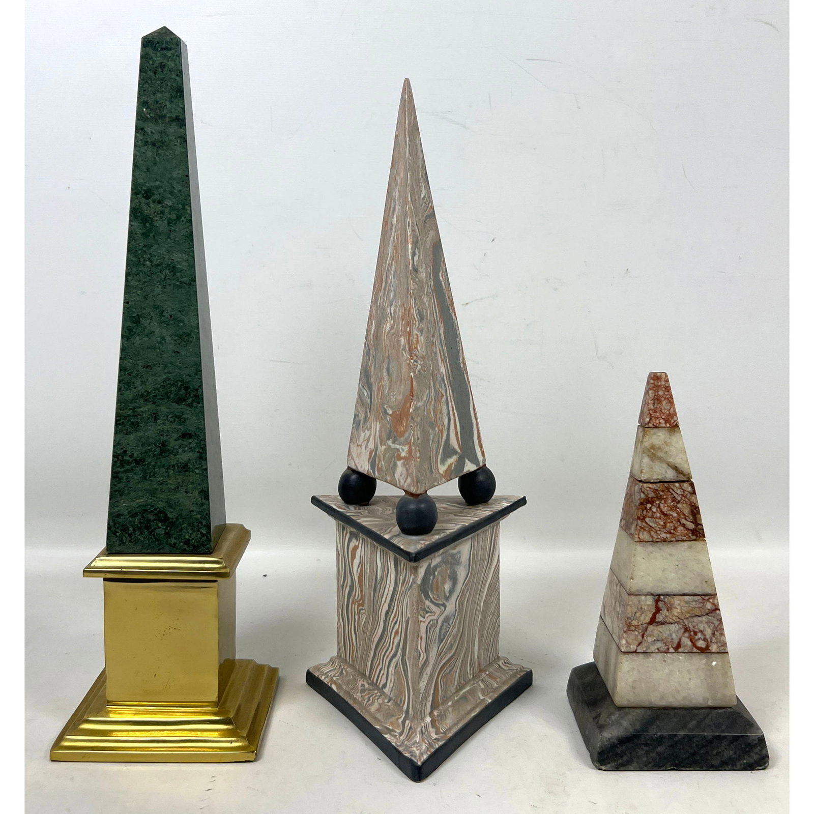 3pc Assorted Decorative Obelisks including Green Marble with Brass Base and Marbled Agate Style and: 3pc Assorted Decorative Obelisks including Green Marble with Brass Base and Marbled Agate Style and Specimen Stone Dimensions: Height: 16 inches, Width: 4.5 inches, Depth: 4.5 inches. --- US Packing a