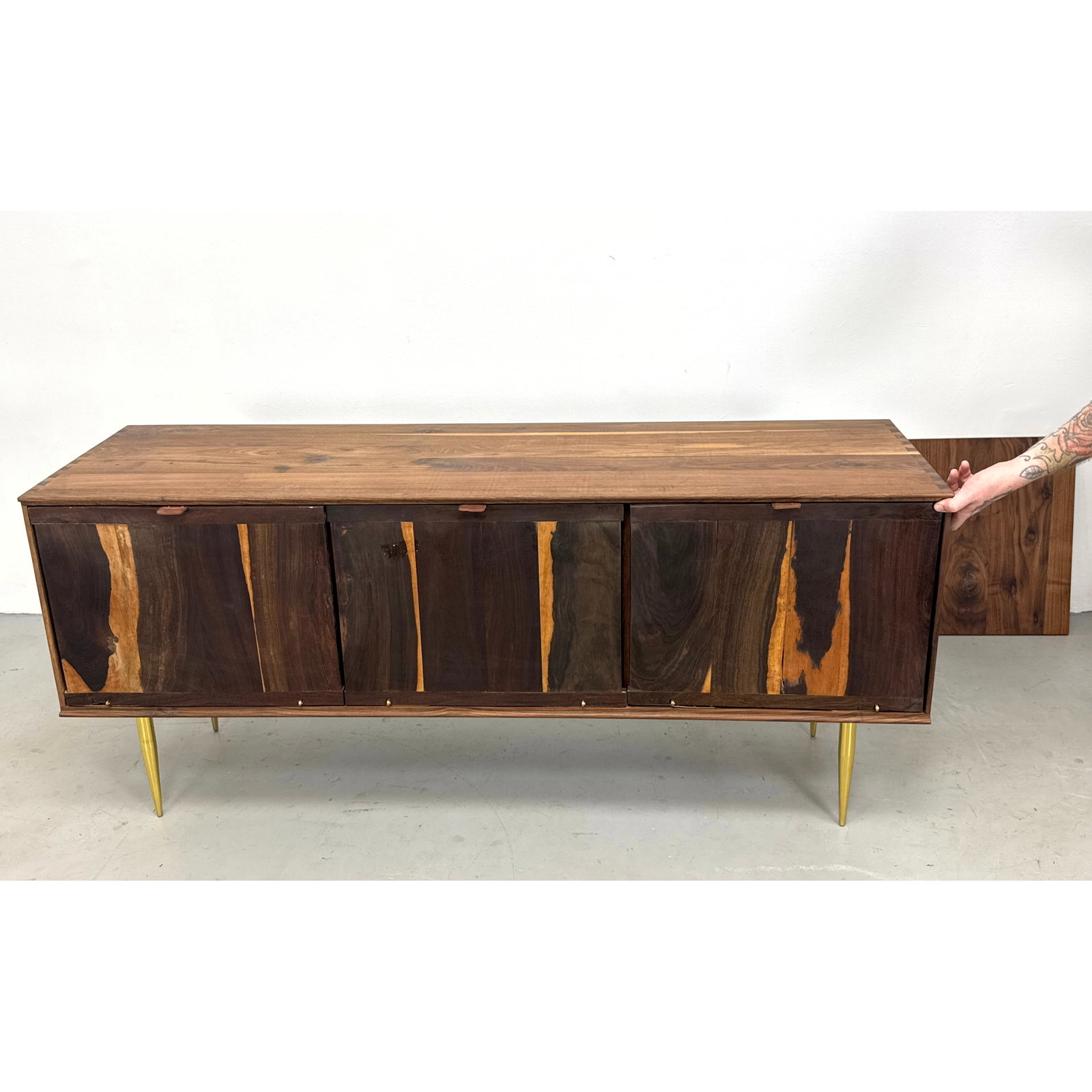 Contemporary Organic Modernism Walnut Three Door Credenza. Brass Legs.: Contemporary Organic Modernism Walnut Three Door Credenza. Brass Legs. Dimensions: Height: 26 inches, Width: 60 inches, Depth: 17.5 inches. ---