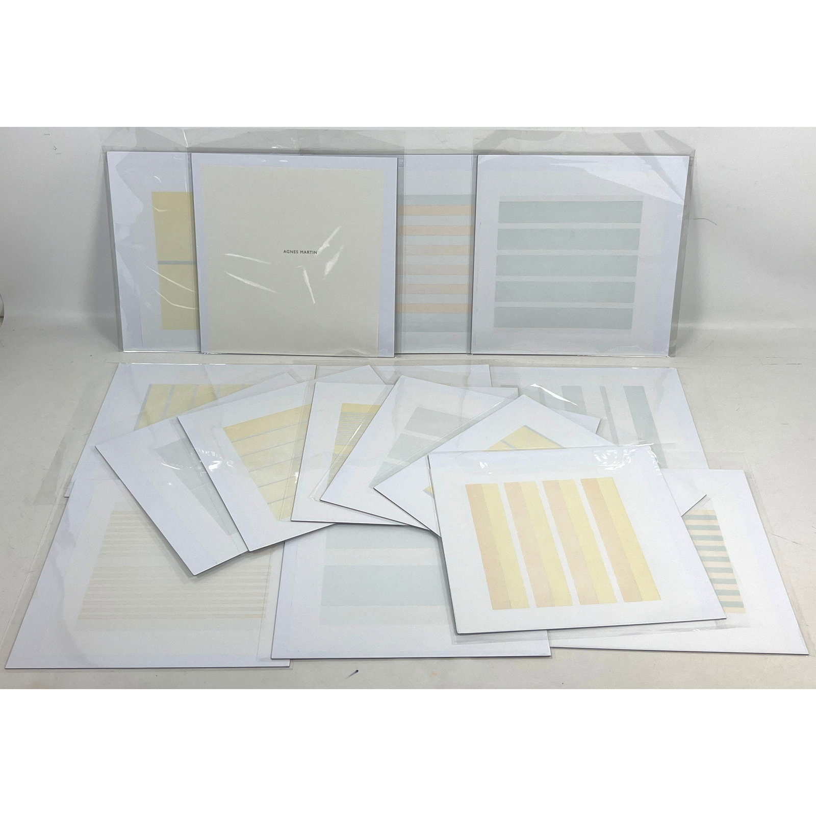 15 Agnes Martin (1912-2004), Vellum Lithographs: 15 Agnes Martin (1912-2004), Vellum Lithographs Dimensions: Height: 11 inches, Width: 11 inches, Depth: 1 inches. --- US Packing and Shipping charge: In house shipping available. Will be calculated