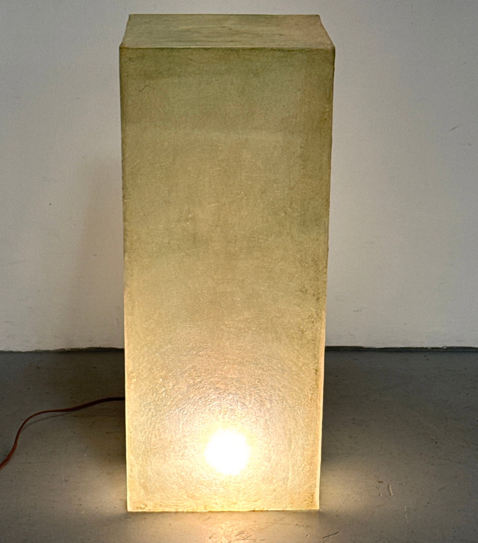 Modernist Translucent Fiberglass Illuminated Pedestal with Mottled Olive Green Finish: Modernist Translucent Fiberglass Illuminated Pedestal with Mottled Olive Green Finish Dimensions: Height: 33.75 inches, Width: 13.5 inches, Depth: 13.75 inches. ---