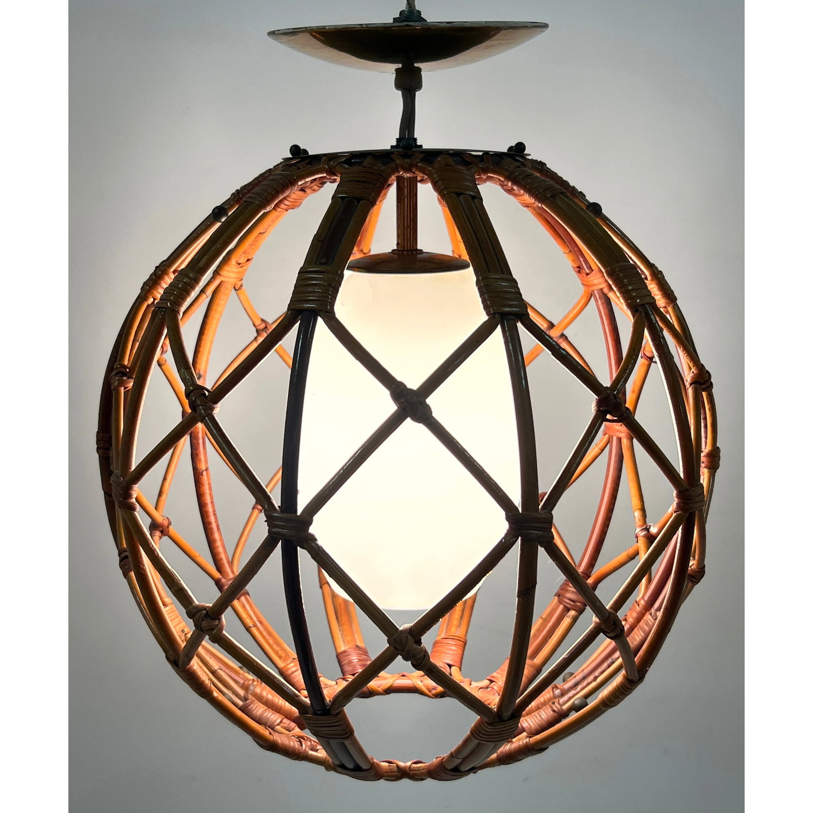 Lightolier Mid Century Modern Woven Rattan Cage Pendant Light with Opaque White Glass Diffuser: Lightolier Mid Century Modern Woven Rattan Cage Pendant Light with Opaque White Glass Diffuser Dimensions: Height: 19 inches, Width: 14 inches, Depth: 14 inches. ---