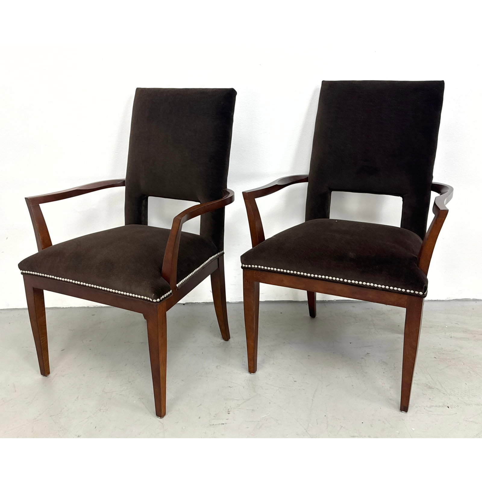 Pair of contemporary dark chocolate brown velvet armchairs featuring angular hardwood frames and sil: Pair of contemporary dark chocolate brown velvet armchairs featuring angular hardwood frames and silver nail head trim Dimensions: Height: 39.5 inches, Width: 26.5 inches, Depth: 24 inches. - Seat Hei