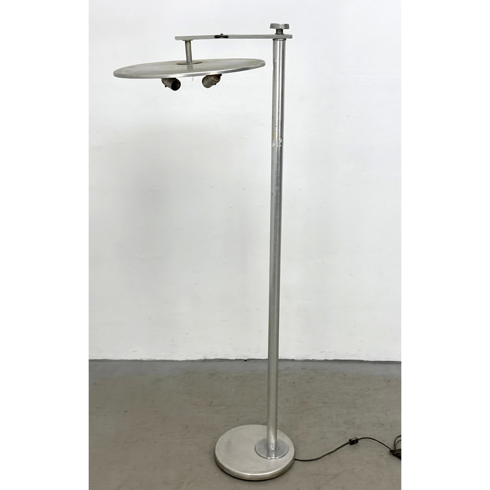 Kurt Versen Modernist Torchiere Floor Lamp in Chrome Plated Steel with Adjustable Disc Shade: Kurt Versen Modernist Torchiere Floor Lamp in Chrome Plated Steel with Adjustable Disc Shade Dimensions: Height: 55.5 inches, Width: 19.5 inches, Depth: 16 inches. ---