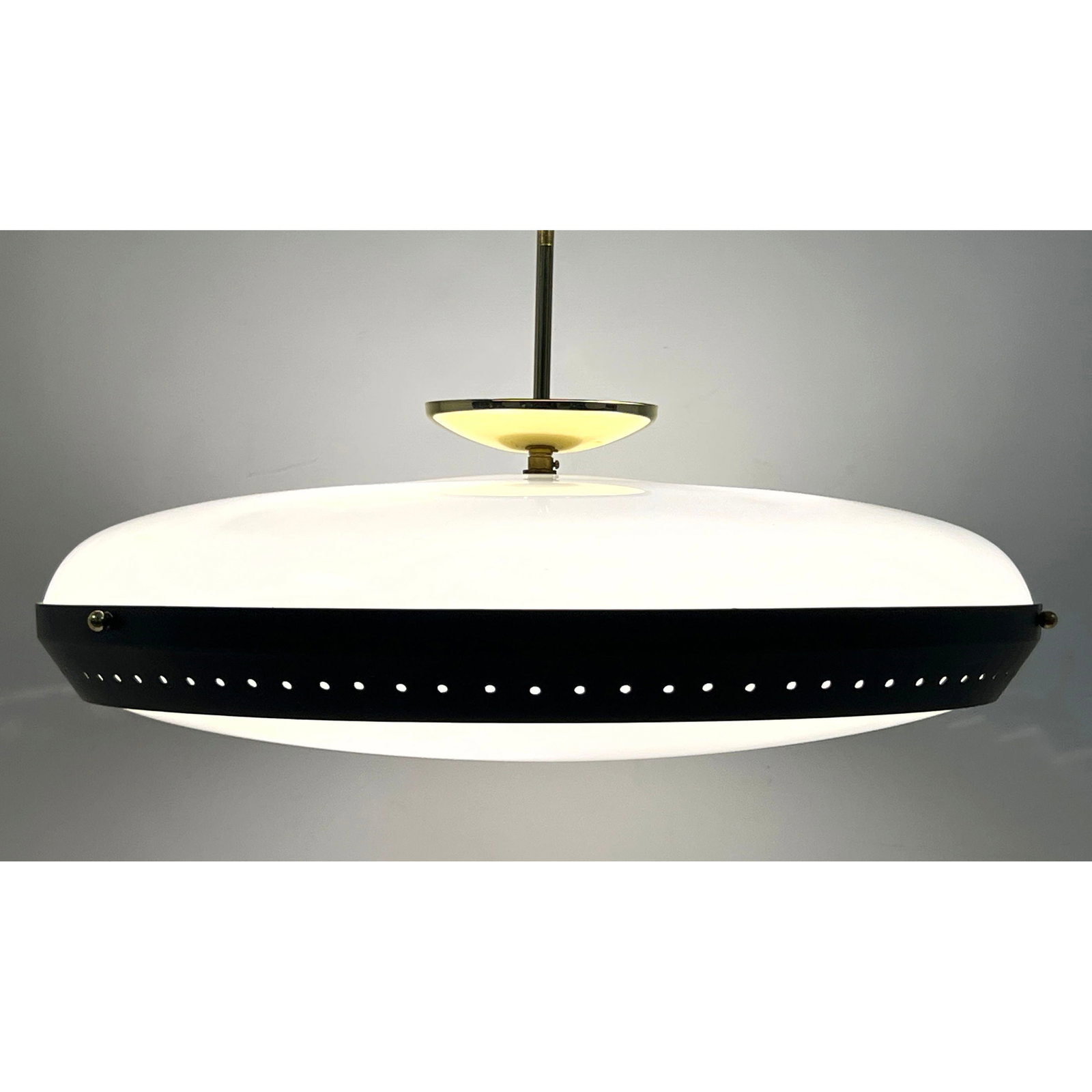 Mid-Century Modern UFO Saucer Pendant Light with Black Enameled Stardust Perforated Band and Brass T: Mid-Century Modern UFO Saucer Pendant Light with Black Enameled Stardust Perforated Band and Brass Toned Hardware. Acrylic shades. Dimensions: Height: 12 inches, Width: 21 inches, Depth: 21 inches. --