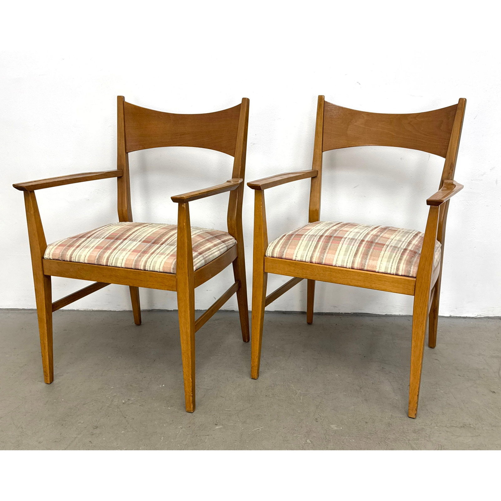 Pair of Mid Century Modern Walnut Armchairs with Bowtie Backs and Scalloped Arms in the Style of Pau: Pair of Mid Century Modern Walnut Armchairs with Bowtie Backs and Scalloped Arms in the Style of Paul McCobb Dimensions: Height: 35 inches, Width: 23 inches, Depth: 19.5 inches. - Seat Height: 17 inch