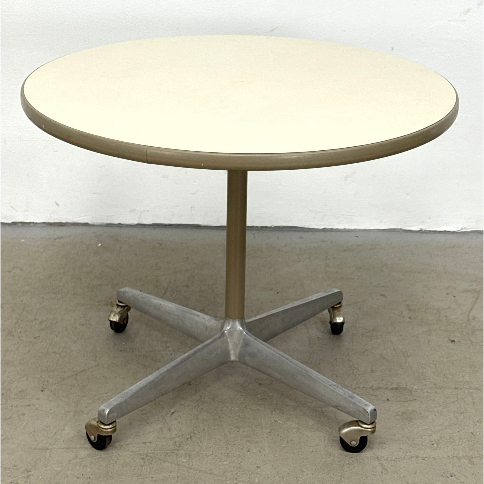 George Nelson for Herman Miller Mobile Pedestal Table with White Laminate Top and Four Star Aluminum (1 of 9)