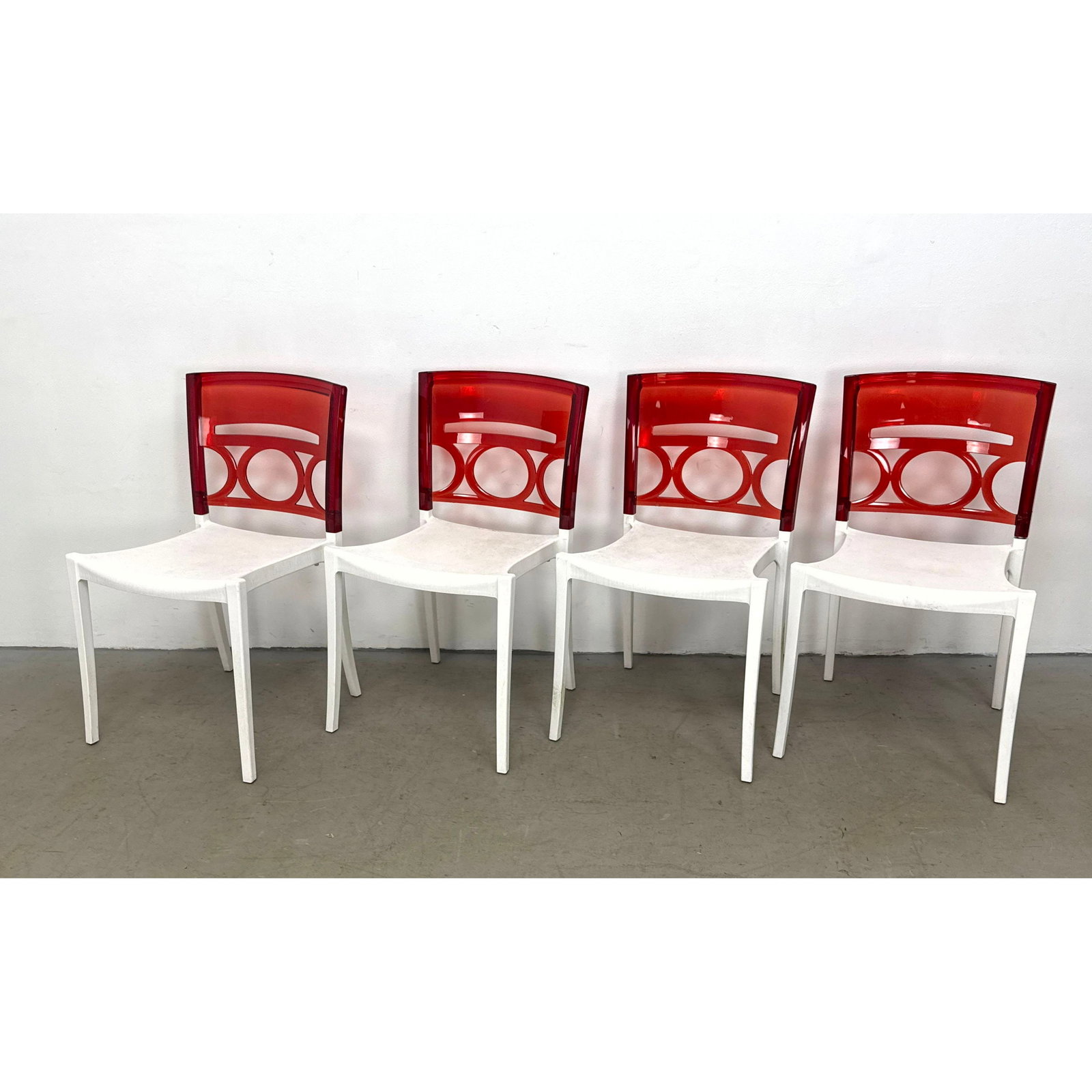 Set Grosfillex O Pera Stackable Side Chairs with Translucent Red Geometric Pattern Backrests (1 of 11)