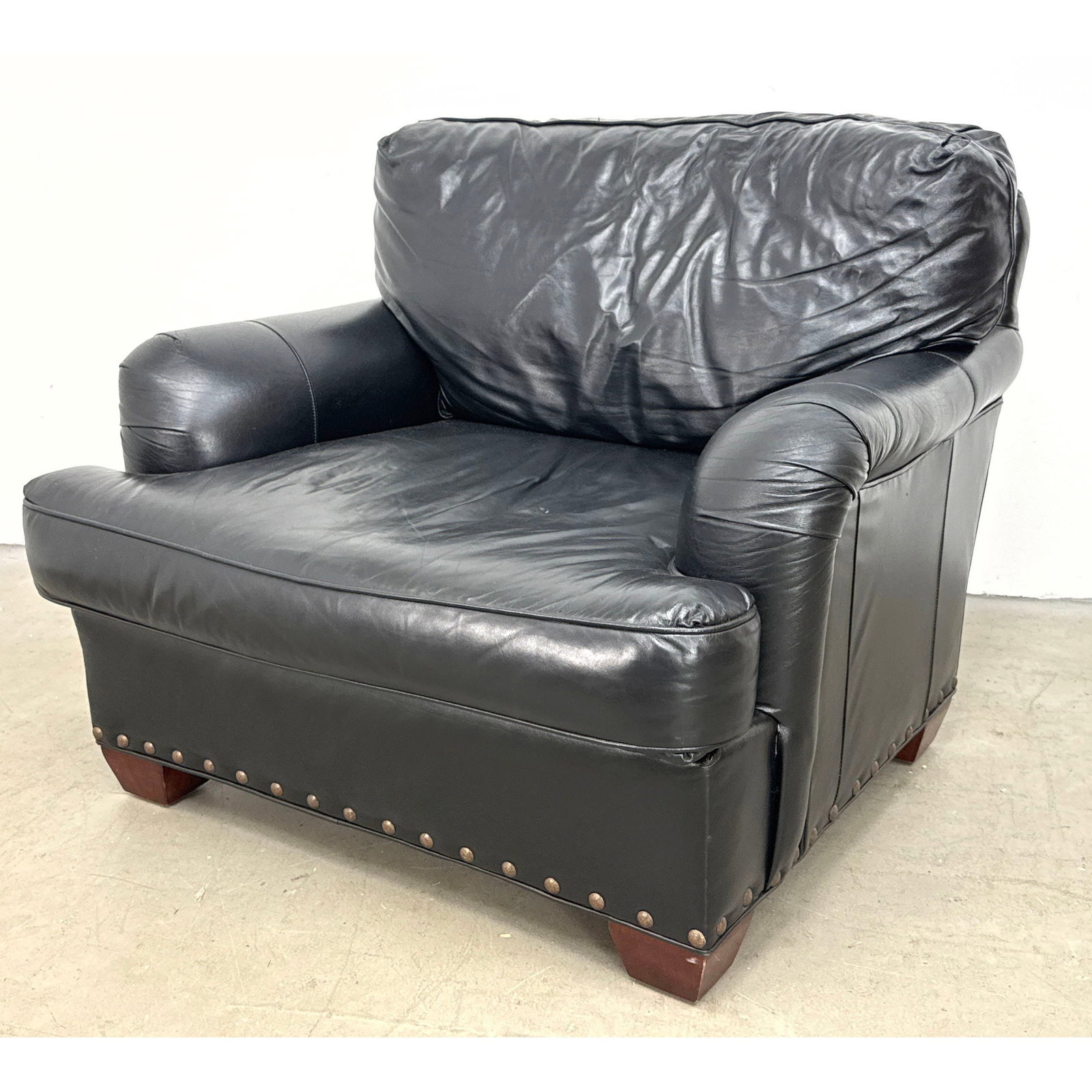 Southwood Reproductions black leather upholstered club chair with antiqued brass nail head trim and (1 of 12)