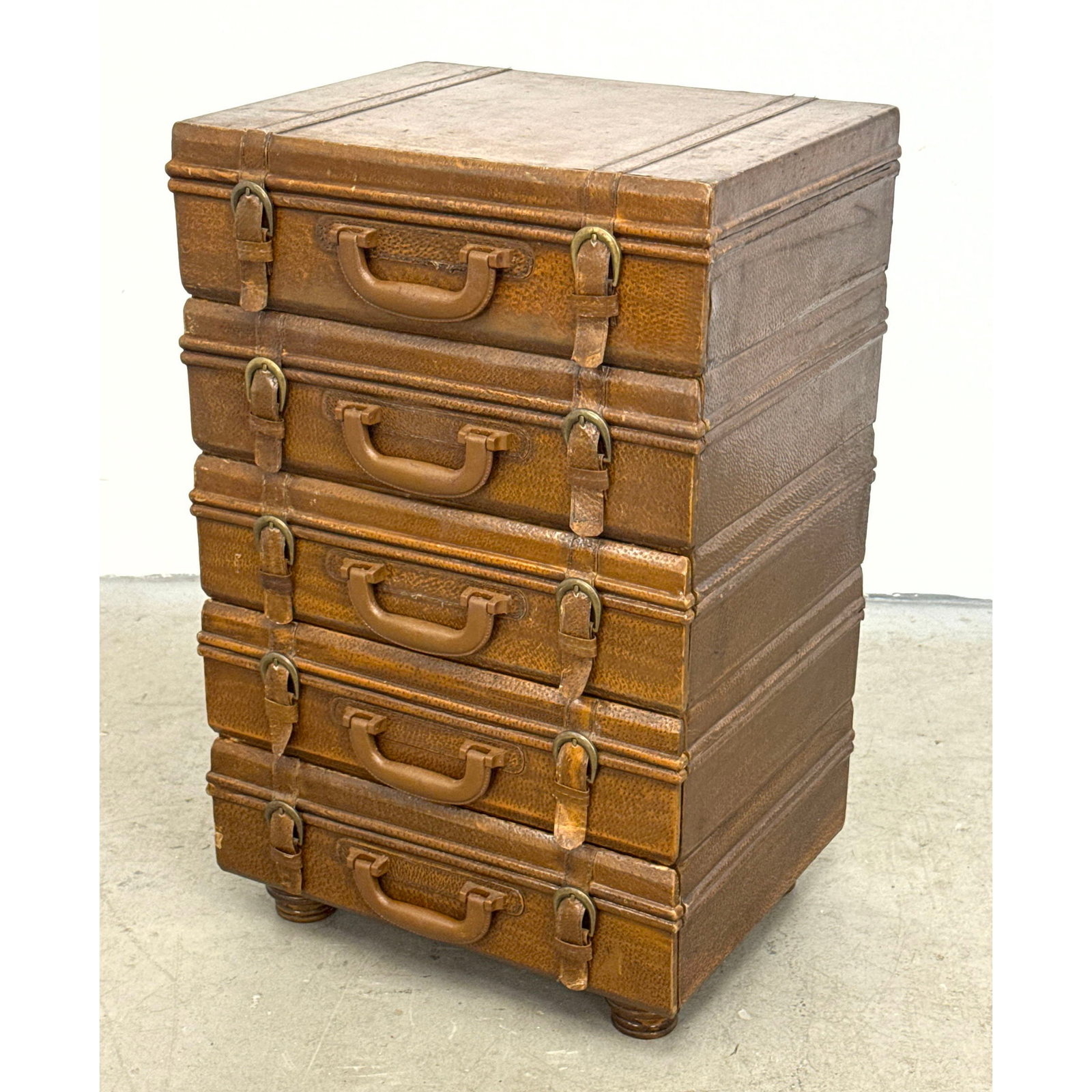 5 drawer stacked suitcase chest of drawers with textured faux leather finish and wooden bun feet (1 of 9)