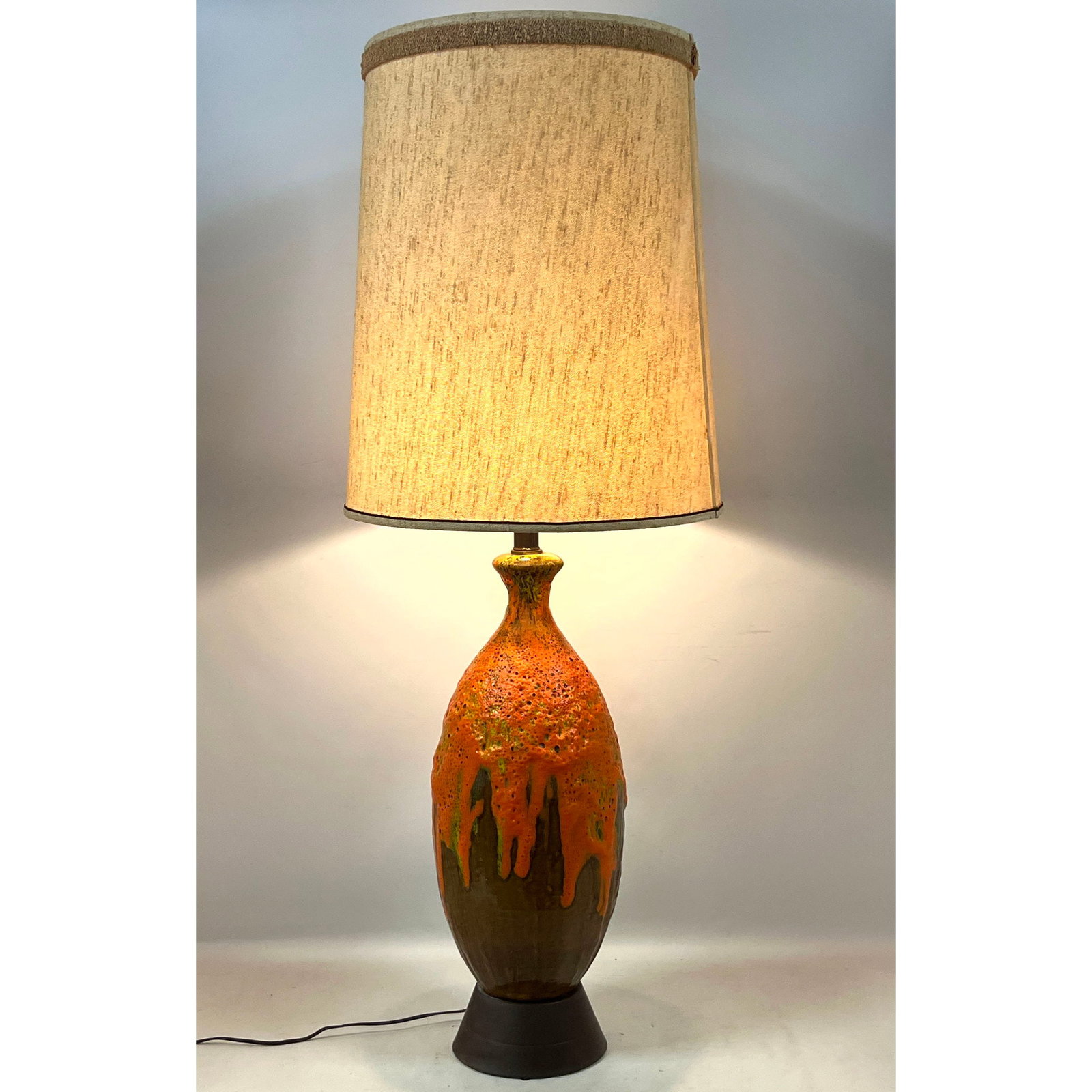 Mid Century Modern Orange Lava Drip Glaze Ceramic Table Lamp.: Mid Century Modern Orange Lava Drip Glaze Ceramic Table Lamp. Dimensions: Height: 44 inches, Width: 9 inches, Depth: 9 inches. ---