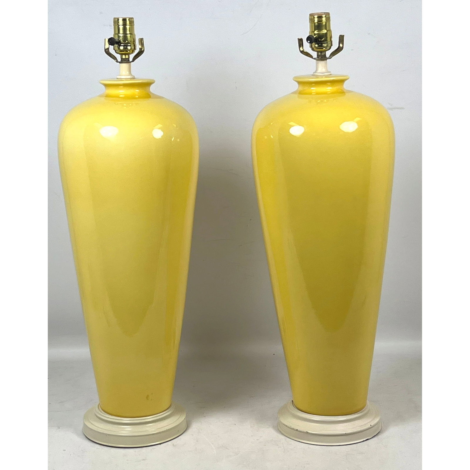 Pr Tyndale Mid-Century Modern Yellow Glazed Ceramic Vase Form Table Lamps on Tiered Cream Bases: Pr Tyndale Mid-Century Modern Yellow Glazed Ceramic Vase Form Table Lamps on Tiered Cream Bases Dimensions: Height: 27 inches, Width: 8 inches, Depth: 8 inches. ---