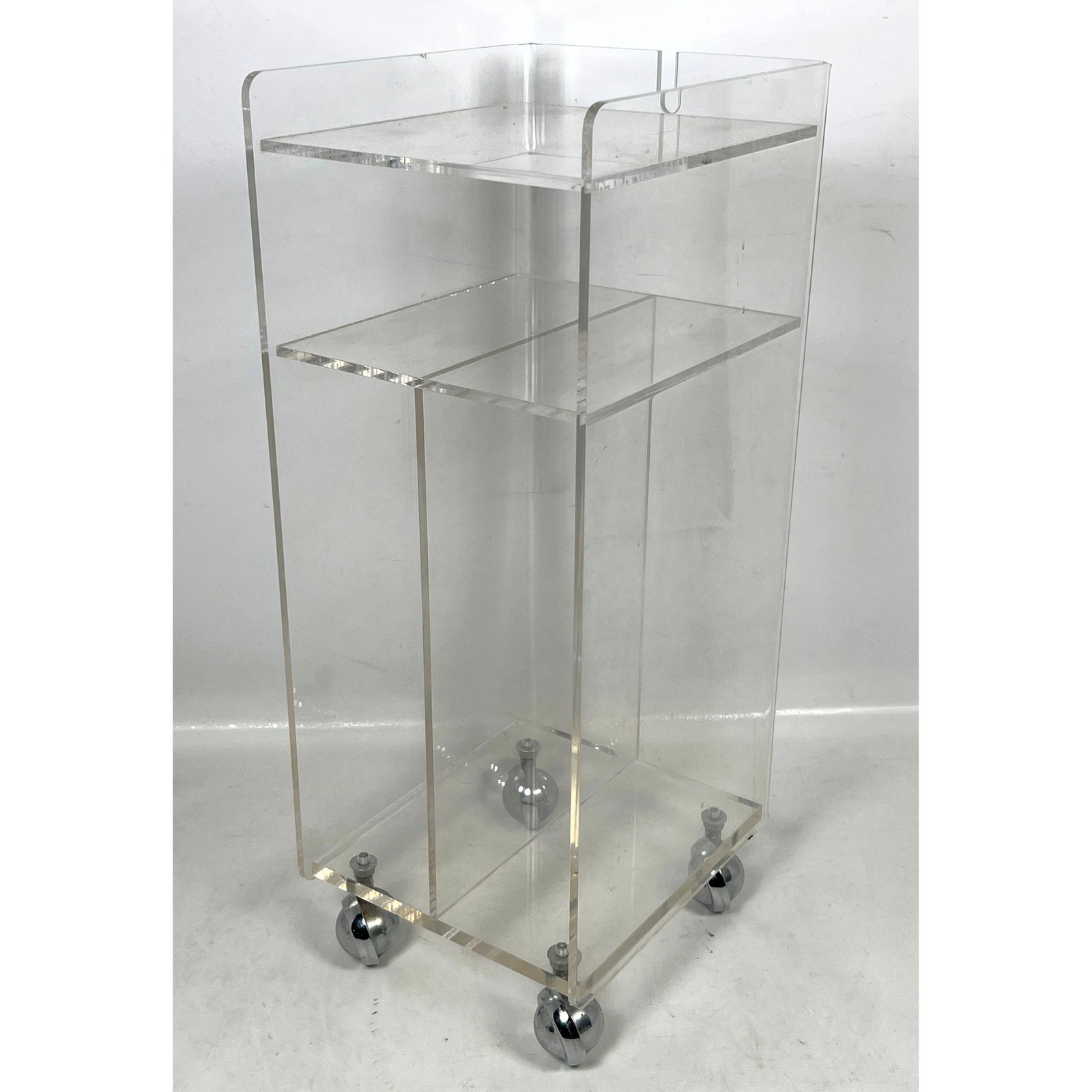 Vintage Mid Century Lucite Rolling Stand.: Vintage Mid Century Lucite Rolling Stand. Dimensions: Height: 23 inches, Width: 9 inches, Depth: 10.5 inches. ---