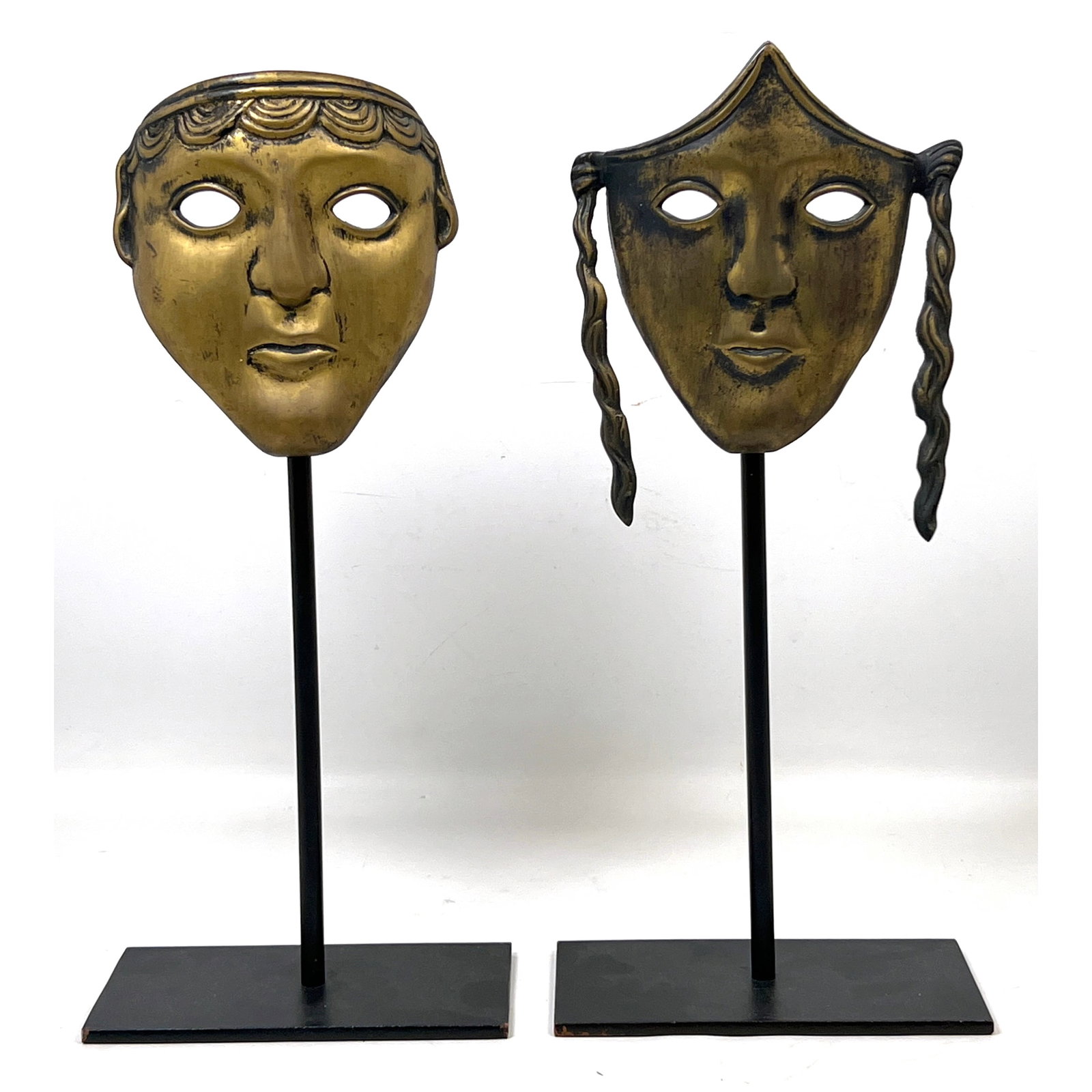 A Pair of Sarreid Ltd Antiqued Brass Neoclassical Theater Drama Masks on Black Metal Stands. Made in: A Pair of Sarreid Ltd Antiqued Brass Neoclassical Theater Drama Masks on Black Metal Stands. Made in Spain. Dimensions: Height: 16 inches, Width: 7 inches, Depth: 4 inches. --- US Packing and Shipping