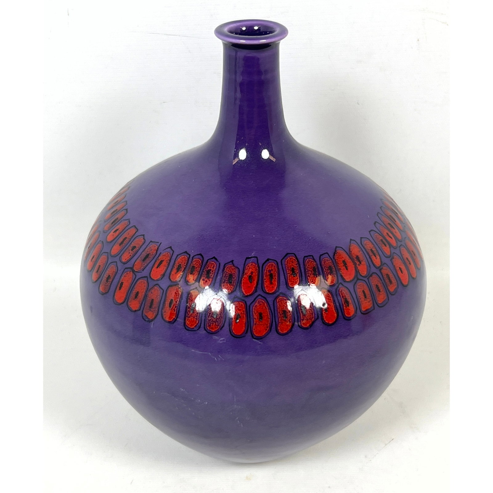 Raymor Mid-Century Modern Italian Earthenware Bottle Vase for. Purple Glaze with hand painted Red Mo: Raymor Mid-Century Modern Italian Earthenware Bottle Vase for. Purple Glaze with hand painted Red Motifs. Model R. 1420. Dimensions: Height: 9 inches, Width: 6 inches, Depth: 6 inches. --- US Packing 