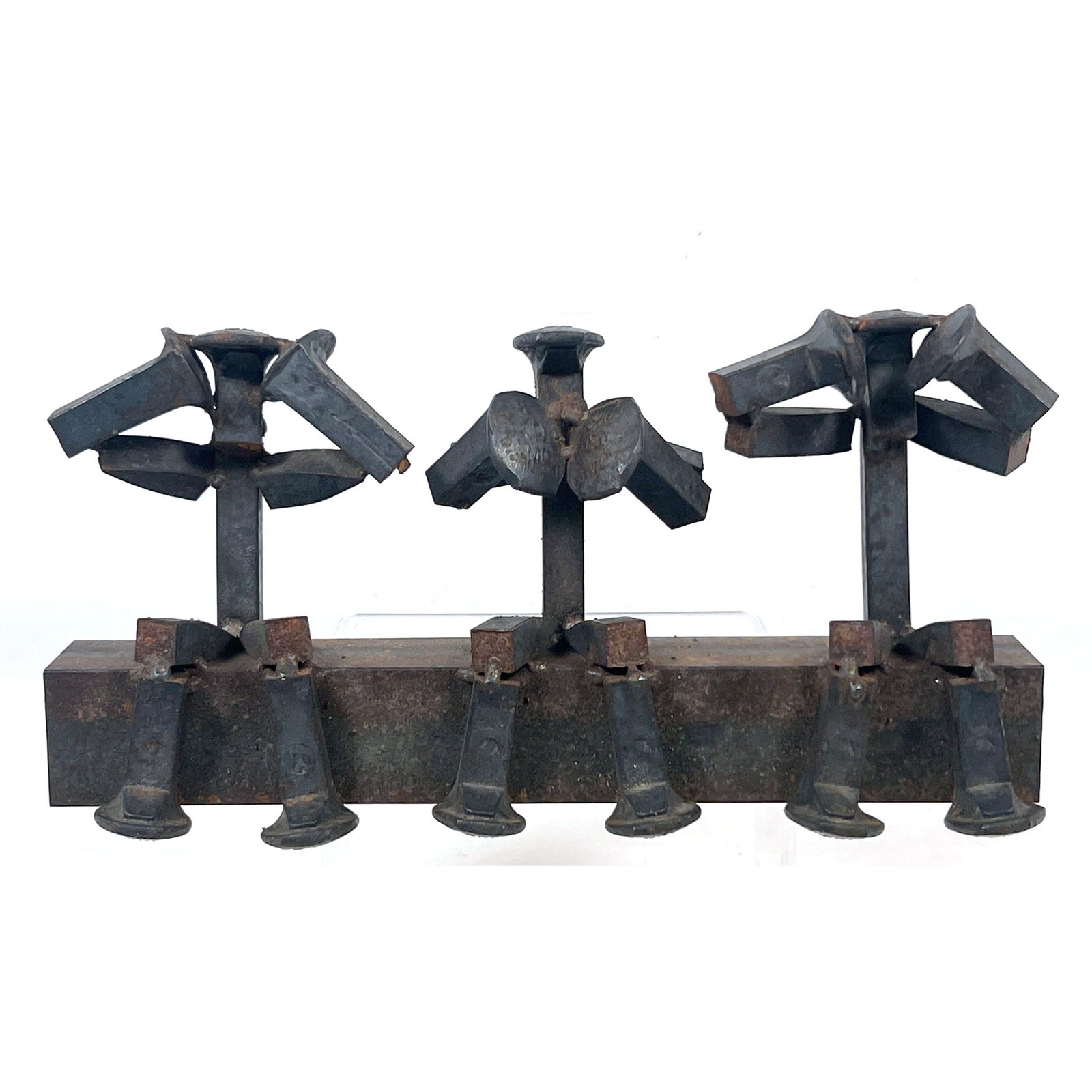Industrial Folk Art Sculpture of a Trio of Stylized Figures Seated on a Beam Constructed from Repurp: Industrial Folk Art Sculpture of a Trio of Stylized Figures Seated on a Beam Constructed from Repurposed Railroad Spikes in 3 Wise Monkeys Motif Dimensions: Height: 7.5 inches, Width: 14 inches, Depth
