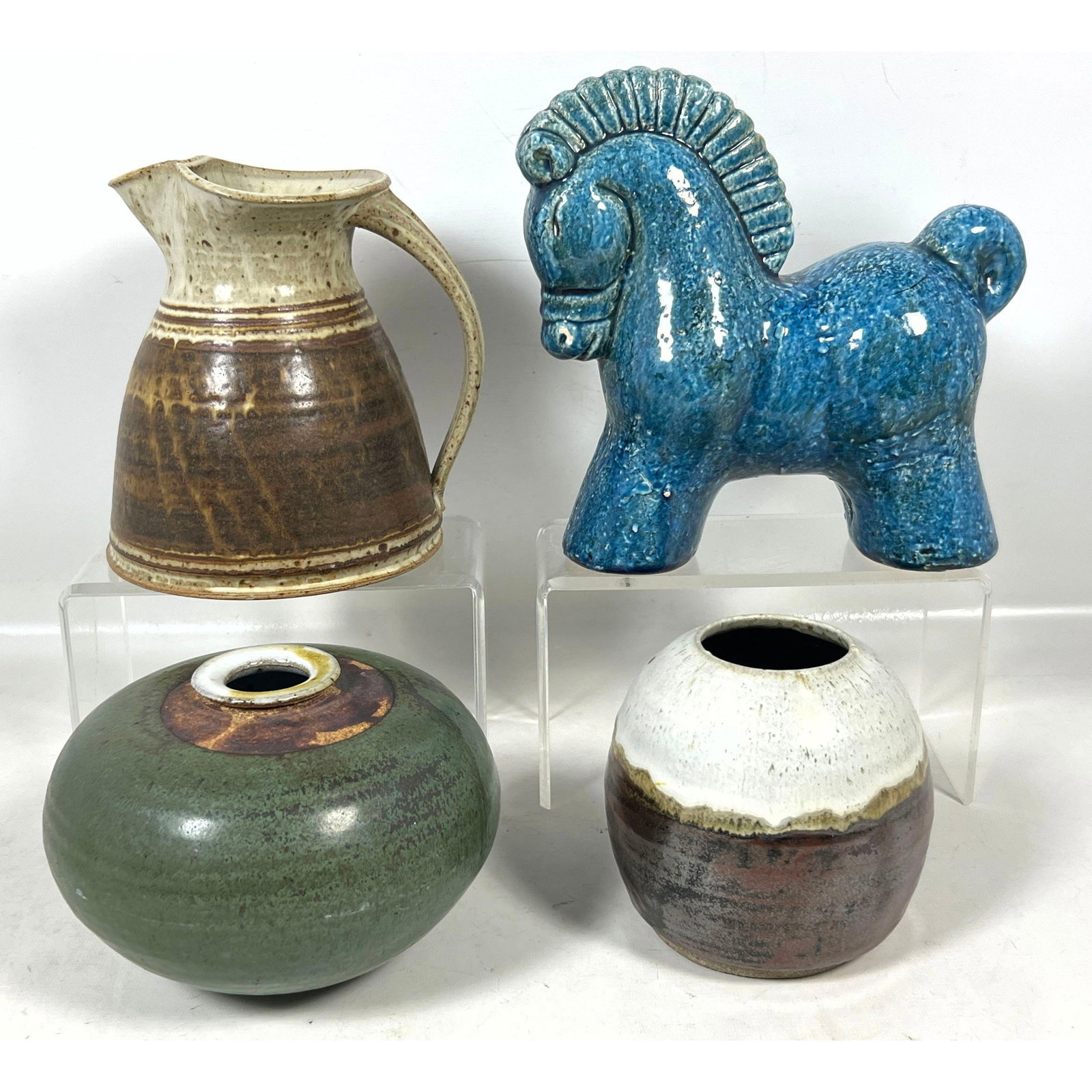 4pc lot of Mid Century and Contemporary Studio Pottery featuring Old Mill Pottery Pitcher Diane Holm: 4pc lot of Mid Century and Contemporary Studio Pottery featuring Old Mill Pottery Pitcher Diane Holmes Weed Pot and Stylized Blue Horse Dimensions: Height: 8 inches, Width: 6 inches, Depth: 6 inches. 