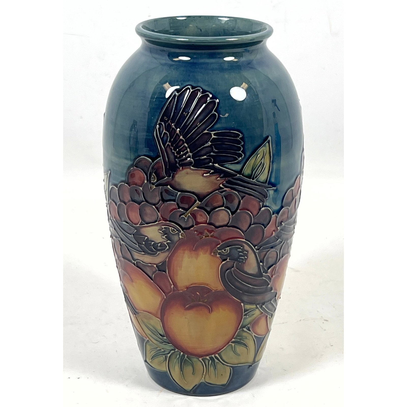 Moorcroft Art Pottery Vase: Finches eating fruit pattern: Impressed and painted marks.: Moorcroft Art Pottery Vase: Finches eating fruit pattern: Impressed and painted marks. Dimensions: Height: 10 inches, Width: 5 inches, Depth: 5 inches. --- US Packing and Shipping charge: In house shi