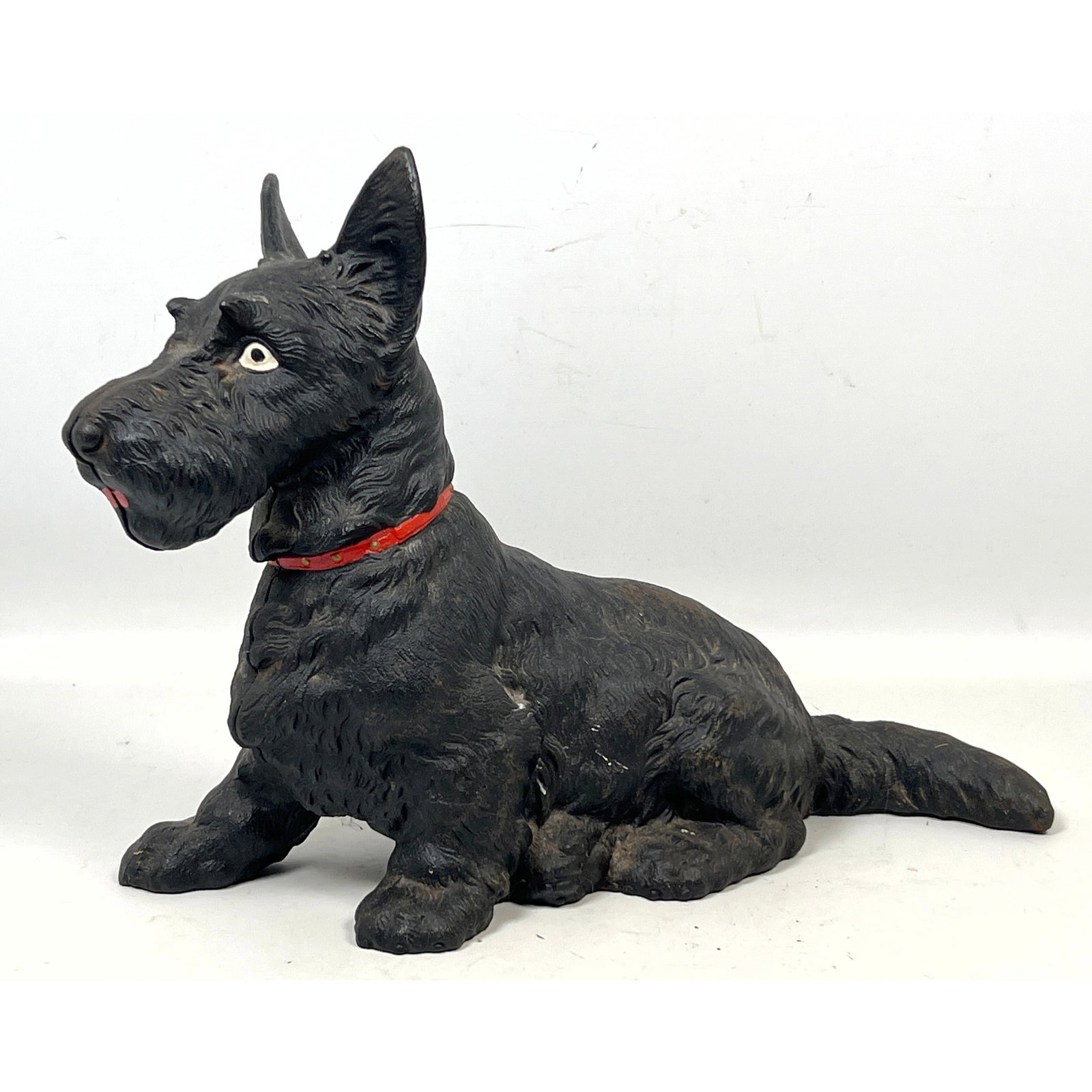 Antique Hubley style Cast Iron Scottish Terrier Dog Doorstop with Painted Red Collar: Antique Hubley style Cast Iron Scottish Terrier Dog Doorstop with Painted Red Collar Dimensions: Height: 11 inches, Width: 7 inches, Depth: 16 inches. ---