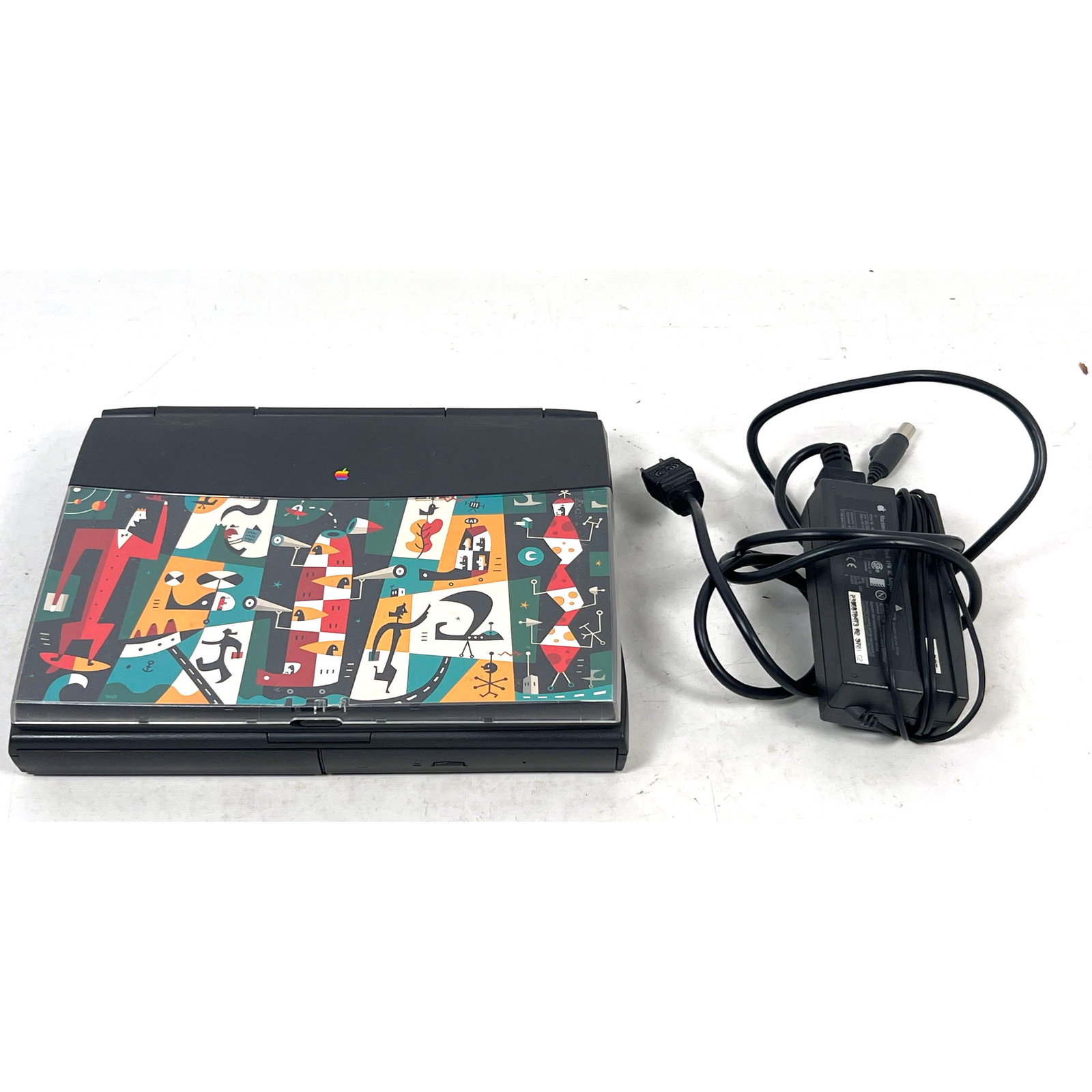 Macintosh PowerBook 1400c Laptop with Graphic Book Cover Lid and Original AC Power Adapter: Macintosh PowerBook 1400c Laptop with Graphic Book Cover Lid and Original AC Power Adapter Dimensions: Height: 2.25 inches, Width: 11.5 inches, Depth: 9 inches. --- US Packing and Shipping charge: In 