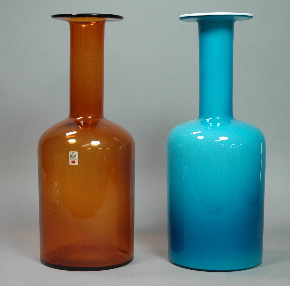 2 HOLMEGAARD Long Necked Bottles Vases. OTTO BRAU: 2 HOLMEGAARD Long Necked Bottles Vases. OTTO BRAUER, designer. One cased glass: turquoise over white. One clear amber glass. One with paper label.-- Dimensions: H: 15 inches --- US Shipping charge: $2