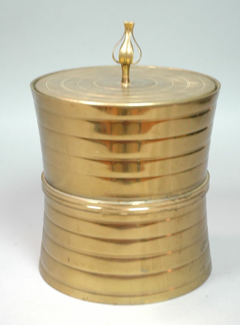 TOMMI PARZINGER Brass Corseted Form Ice Bucket. N: TOMMI PARZINGER Brass Corseted Form Ice Bucket. Neat Organic Finial. Horizontal rib pattern. Original Thermos liner. Marked.-- Dimensions: H: 11 inches: W: 7.5 inches: D: 7.5 inches --- US Shipping ch