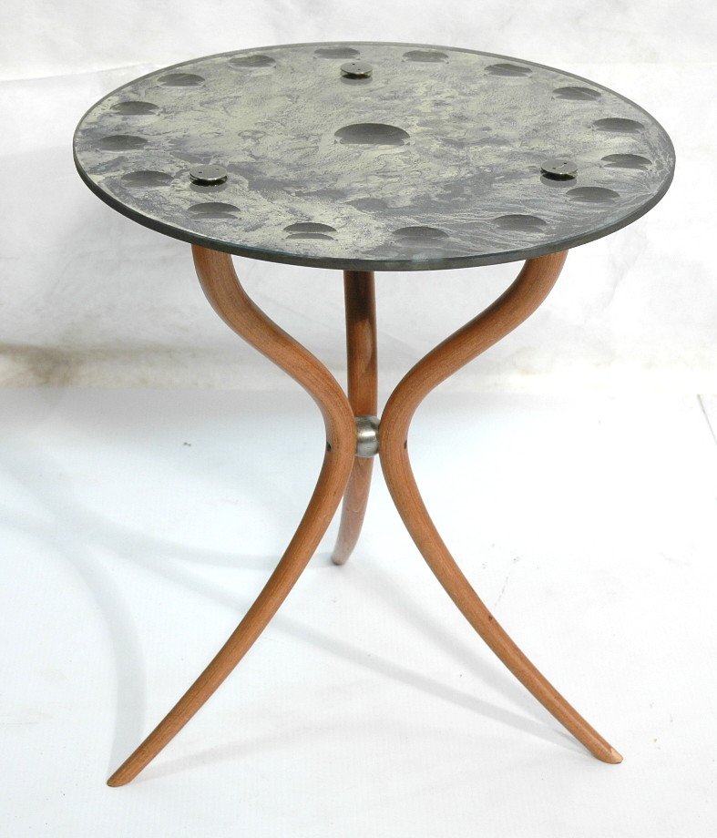 FORNASETTI style Antiqued Mirror Top Side Table.: FORNASETTI style Antiqued Mirror Top Side Table. Curvaceous tripod base. Mirrored top has recessed spots. -- Dimensions: H: 23 inches: W: 19.75 inches ---