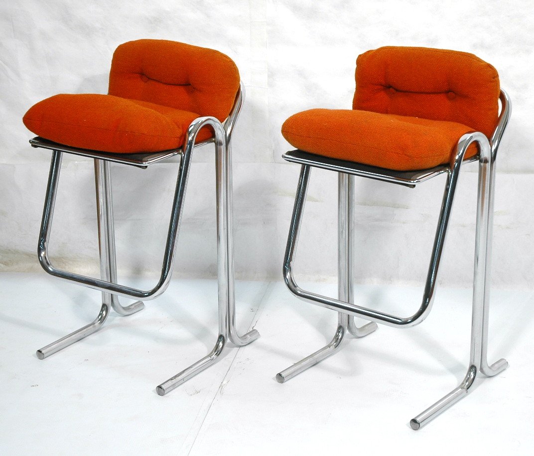 Pr Thick Chrome Tubular 70's Modern Bar Stools. O: Pr Thick Chrome Tubular 70's Modern Bar Stools. Orange Upholstery. Foot rest.-- Dimensions: H: 37.5 inches: W: 20 inches: D: 19.5 inches ---