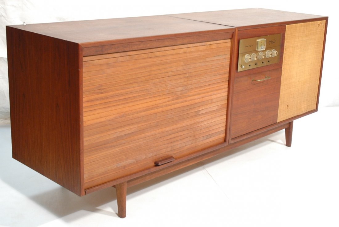 JENS RISOM Two Cabinet Unit. Two American Modern: JENS RISOM Two Cabinet Unit. Two American Modern walnut cabinets sit on single base. One tambour door unit. One stereo cabinet unit. Has drawer for turntable. Not marked.-- Dimensions: H: 31.75 inches