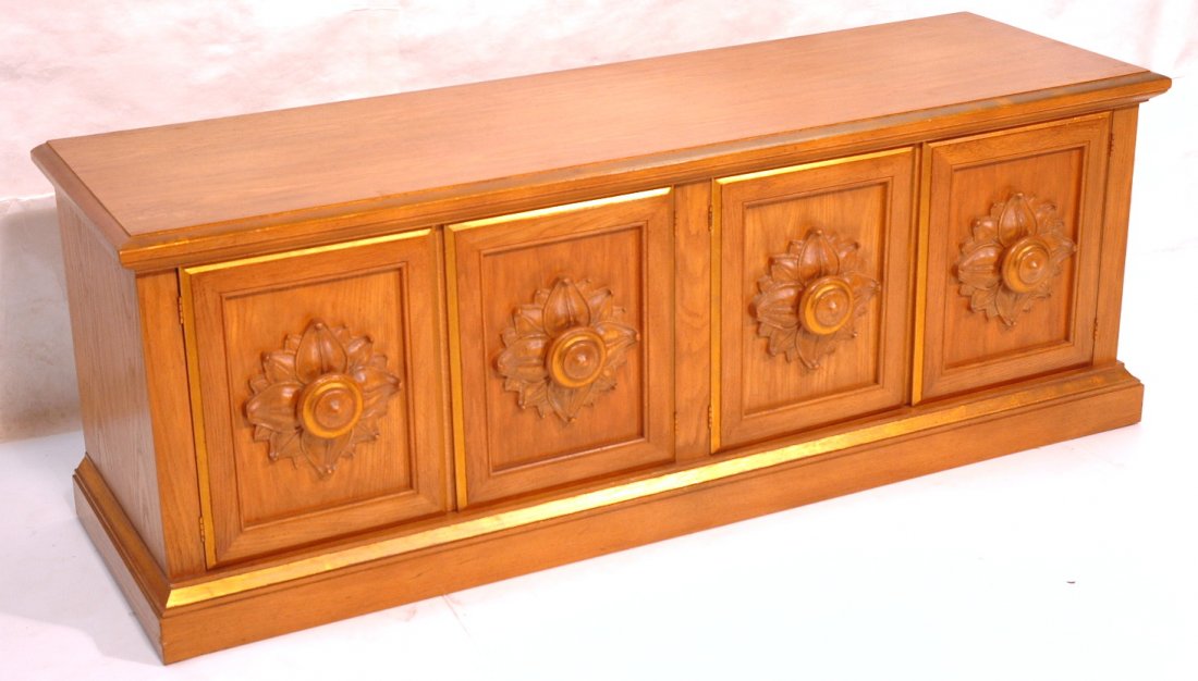 Decorator JAMES MONT style Credenza. Four Floral: Decorator JAMES MONT style Credenza. Four Floral carved door panels. Gilt paint trim & accents. Drexel label in drawer. -- Dimensions: H: 26 inches: W: 72 inches: D: 22 inches ---