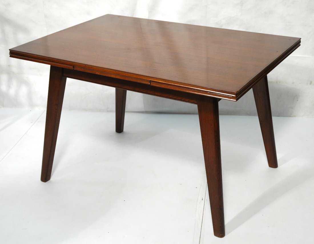 JEAN ROYERE style Oak Refractory Dining Table. Th: JEAN ROYERE style Oak Refractory Dining Table. Thick angled legs. -- Dimensions: H: 29.5 inches: W: 47.5 inches: D: 32.5 inches ---