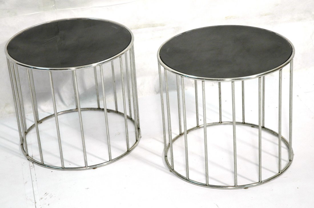 Pr Spindle form drum side tables. Chrome Circular: Pr Spindle form drum side tables. Chrome Circular drum form. Inset black tempered glass.-- Dimensions: H: 18 inches: W: 20 inches ---