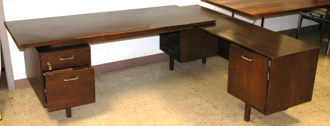 JENS RISOM L shaped Executive Desk. American Mode: JENS RISOM L shaped Executive Desk. American Modern Walnut. One cabinet with interior shelves. One cabinet with two drawers. -- Dimensions: H: 28 inches: W: 84 inches: D: 68 inches ---