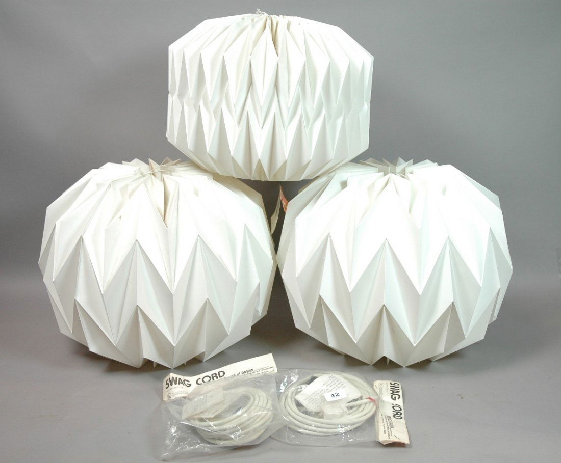 3pcs LE KLINT Folded Plastic Hanging Shades. Pend: 3pcs LE KLINT Folded Plastic Hanging Shades. Pendant Lamps. With 3 DANSK Hanging Cords(still in package). -- Dimensions: H: 14 inches: W: 18 inches ---